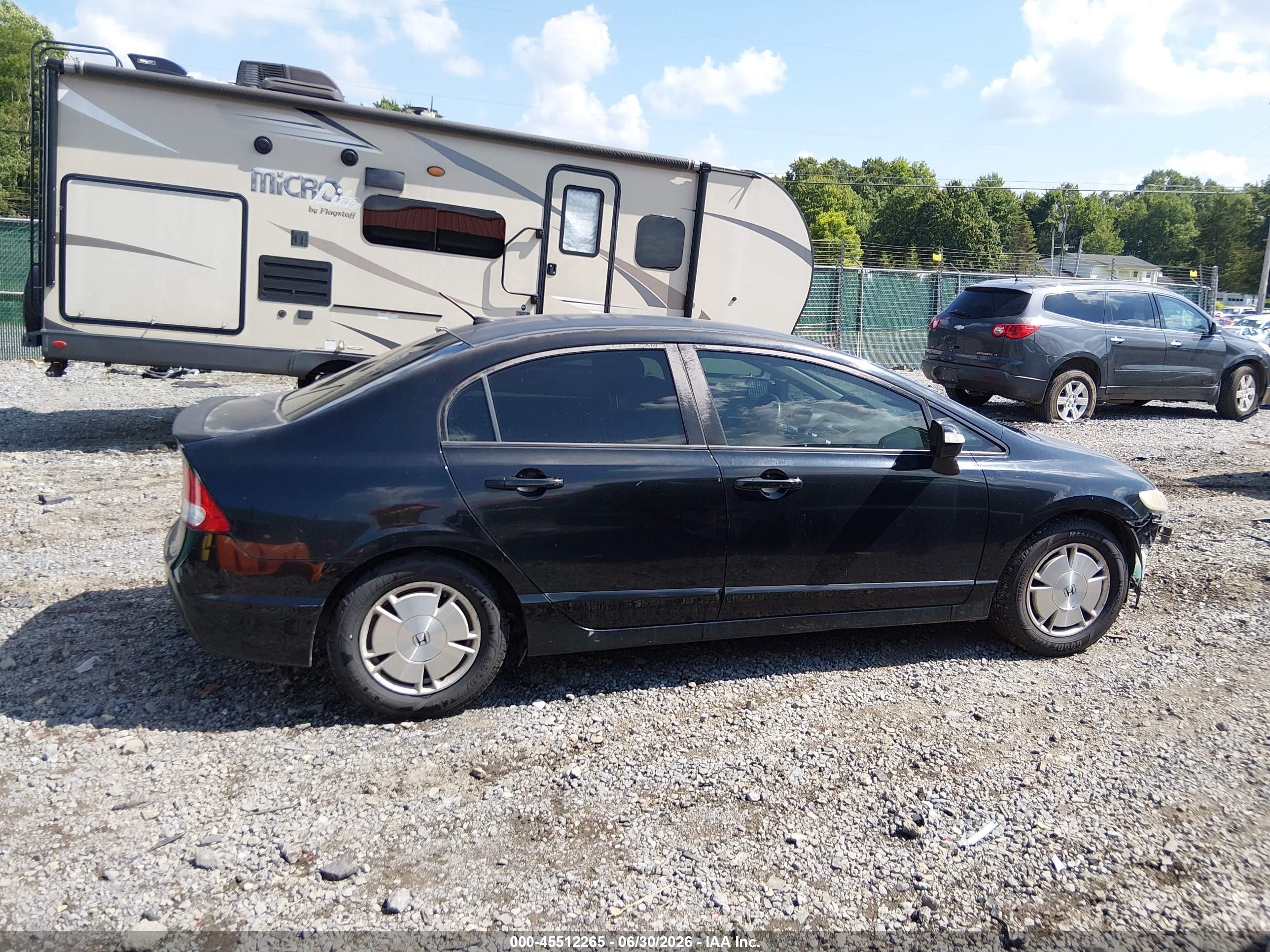 2009 Honda Civic Hybrid   Black vin: JHMFA362X9S018121