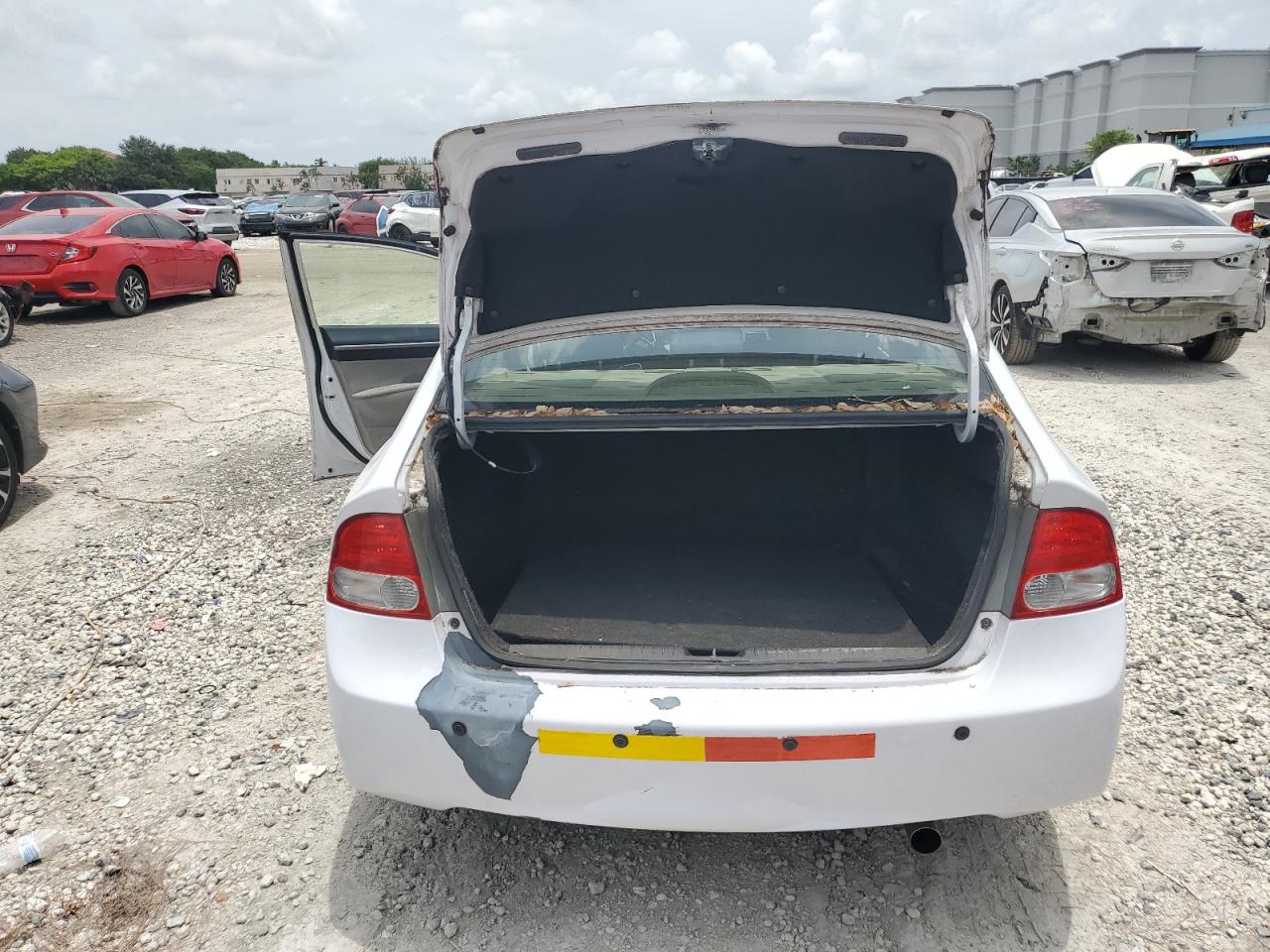 2011 Honda Civic Hybrid White vin: JHMFA3F25BS000129 Damage: Rear Bumper, Peeling, > 12 Inches