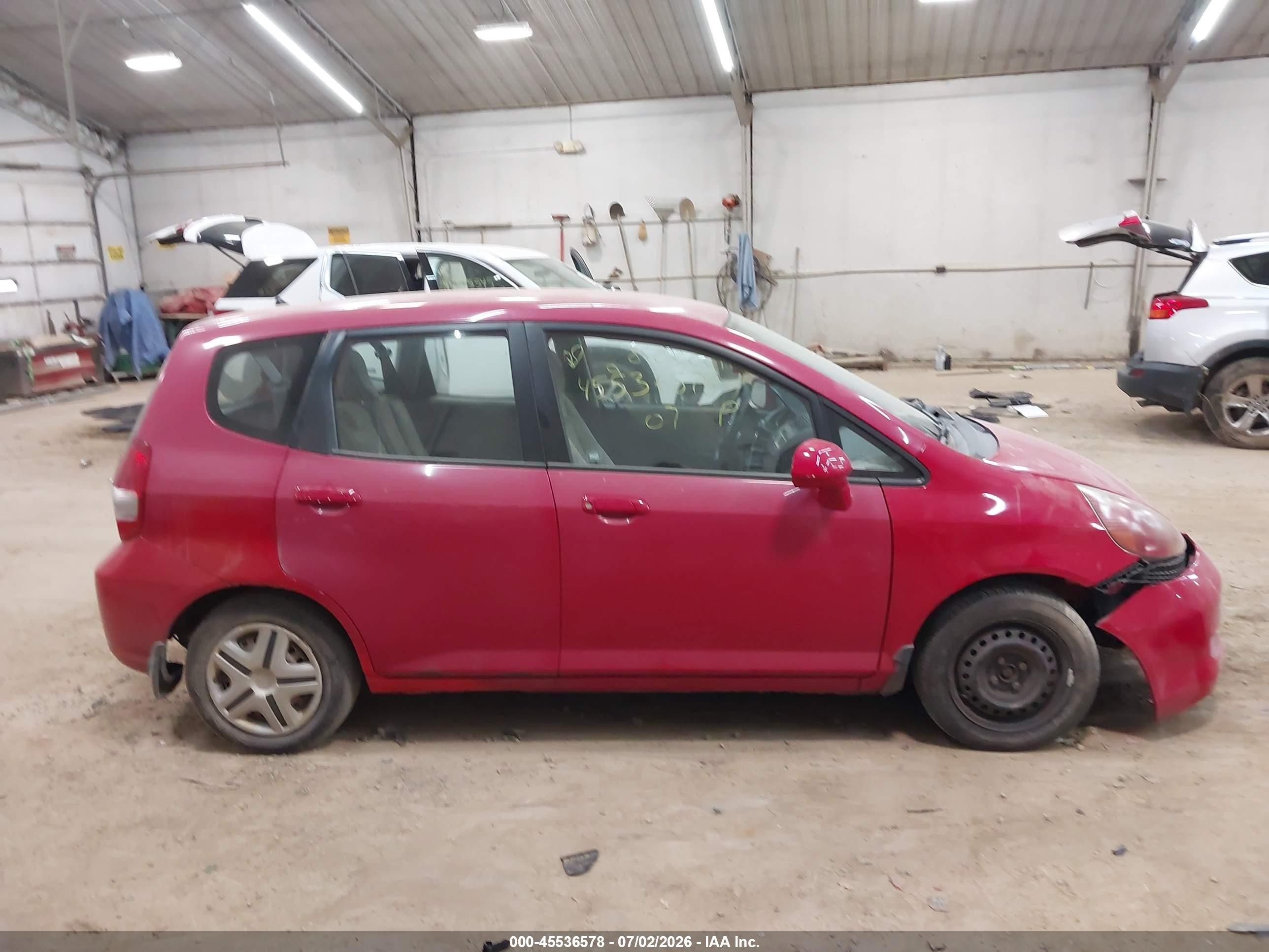2007 Honda Fit   Red vin: JHMGD38437S021367