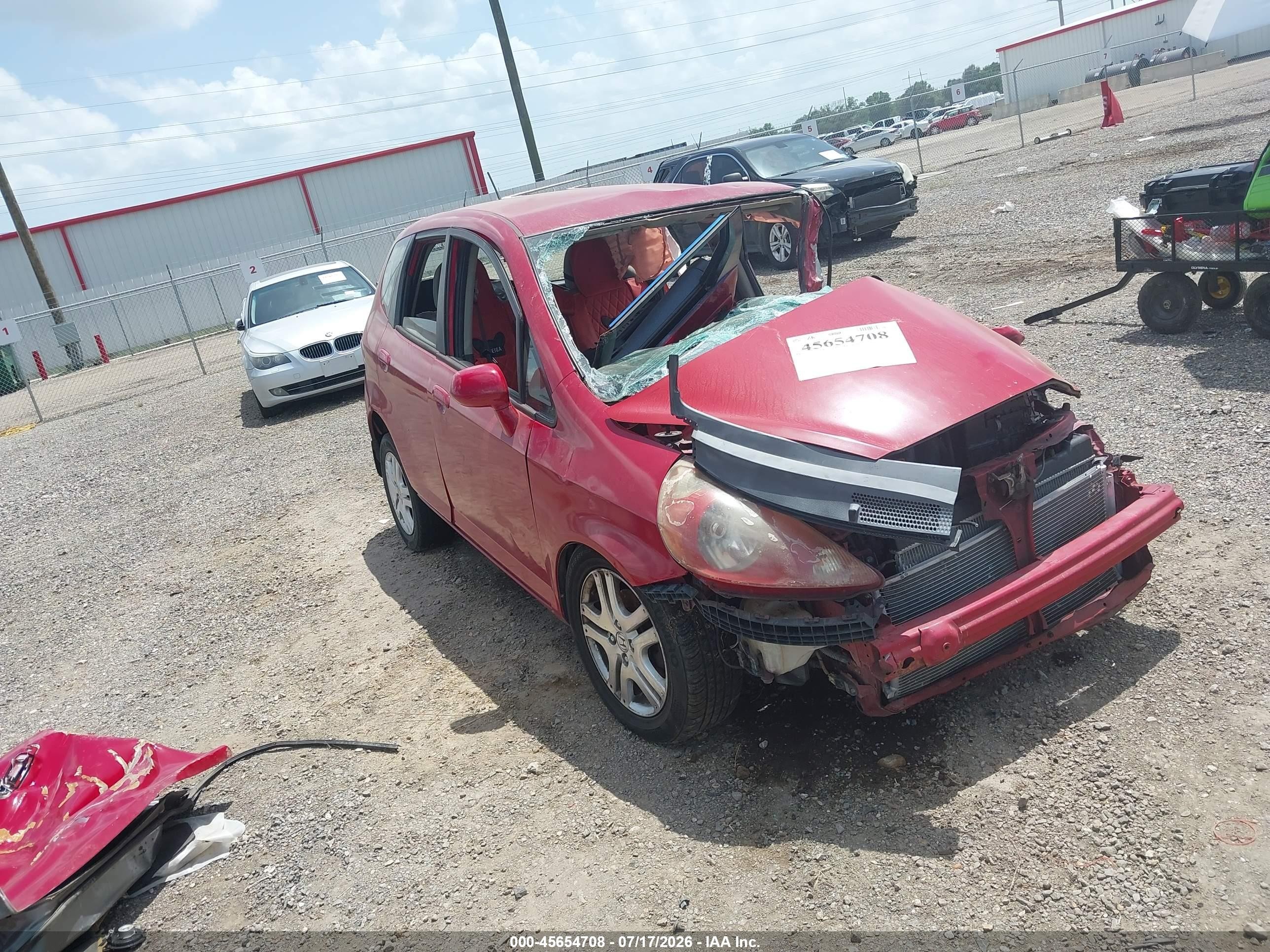 2007 Honda Fit   Red vin: JHMGD384X7S052552