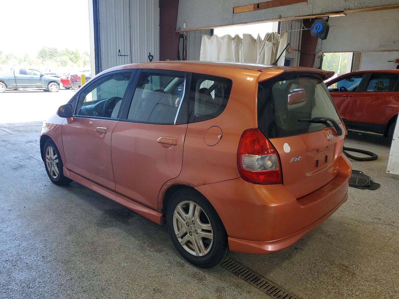 2007 Honda Fit S Orange vin: JHMGD38637S021760