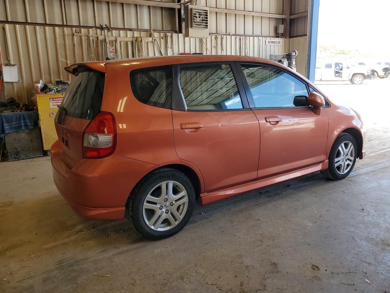 2007 Honda Fit S Orange vin: JHMGD38687S068539