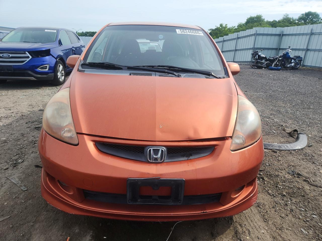 2007 Honda Fit Orange vin: JHMGD386X7S027202
