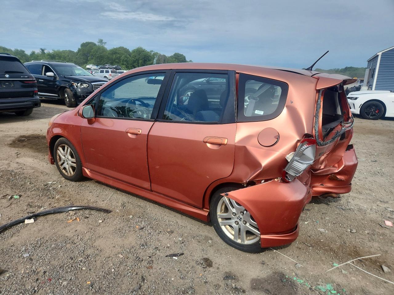 2007 Honda Fit Orange vin: JHMGD386X7S027202