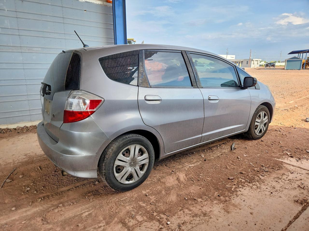 2009 Honda Fit Silver vin: JHMGE87209S048006