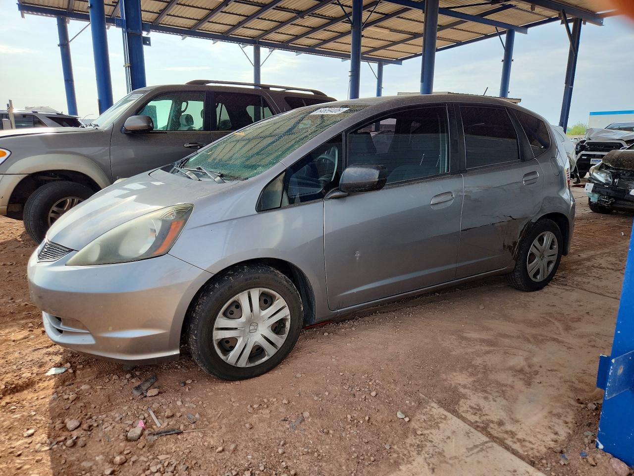 2009 Honda Fit Silver vin: JHMGE87209S048006