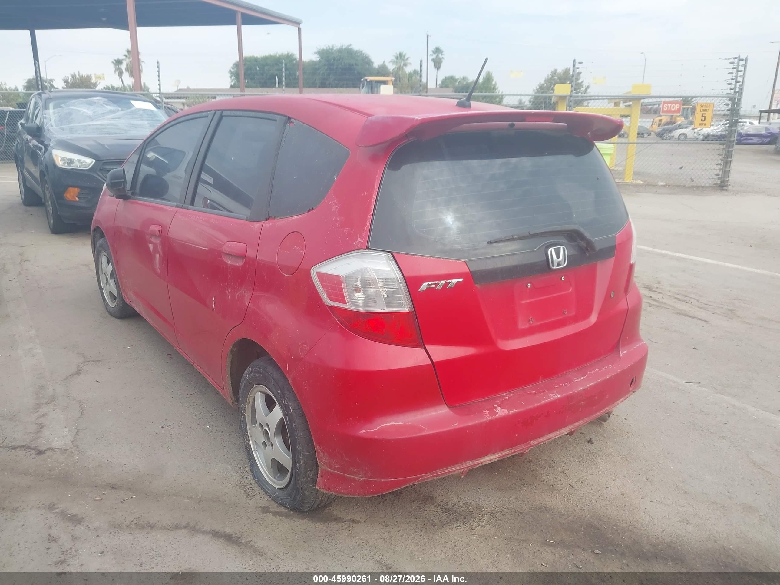 2009 Honda Fit   Red vin: JHMGE87299S009429