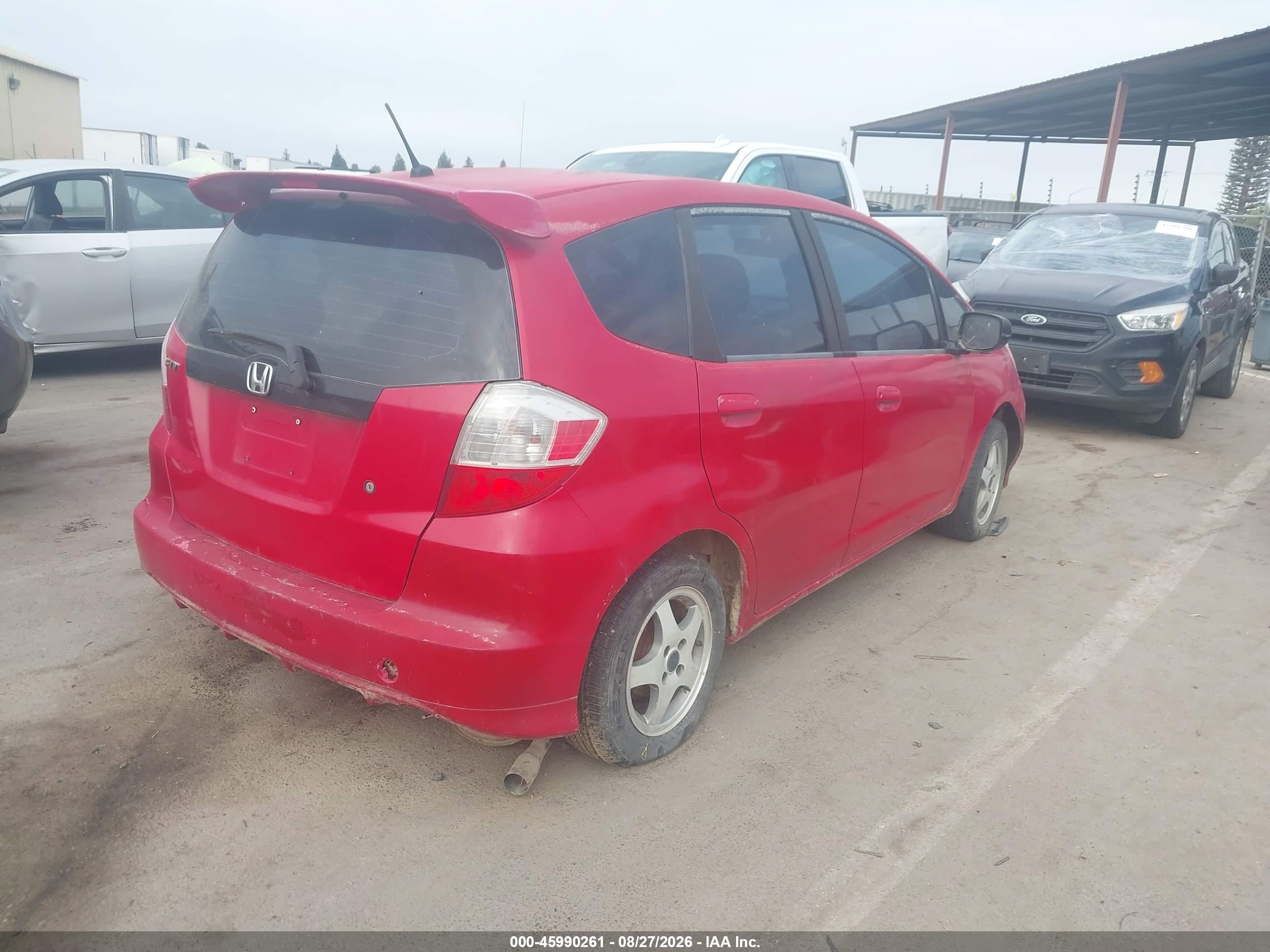2009 Honda Fit   Red vin: JHMGE87299S009429
