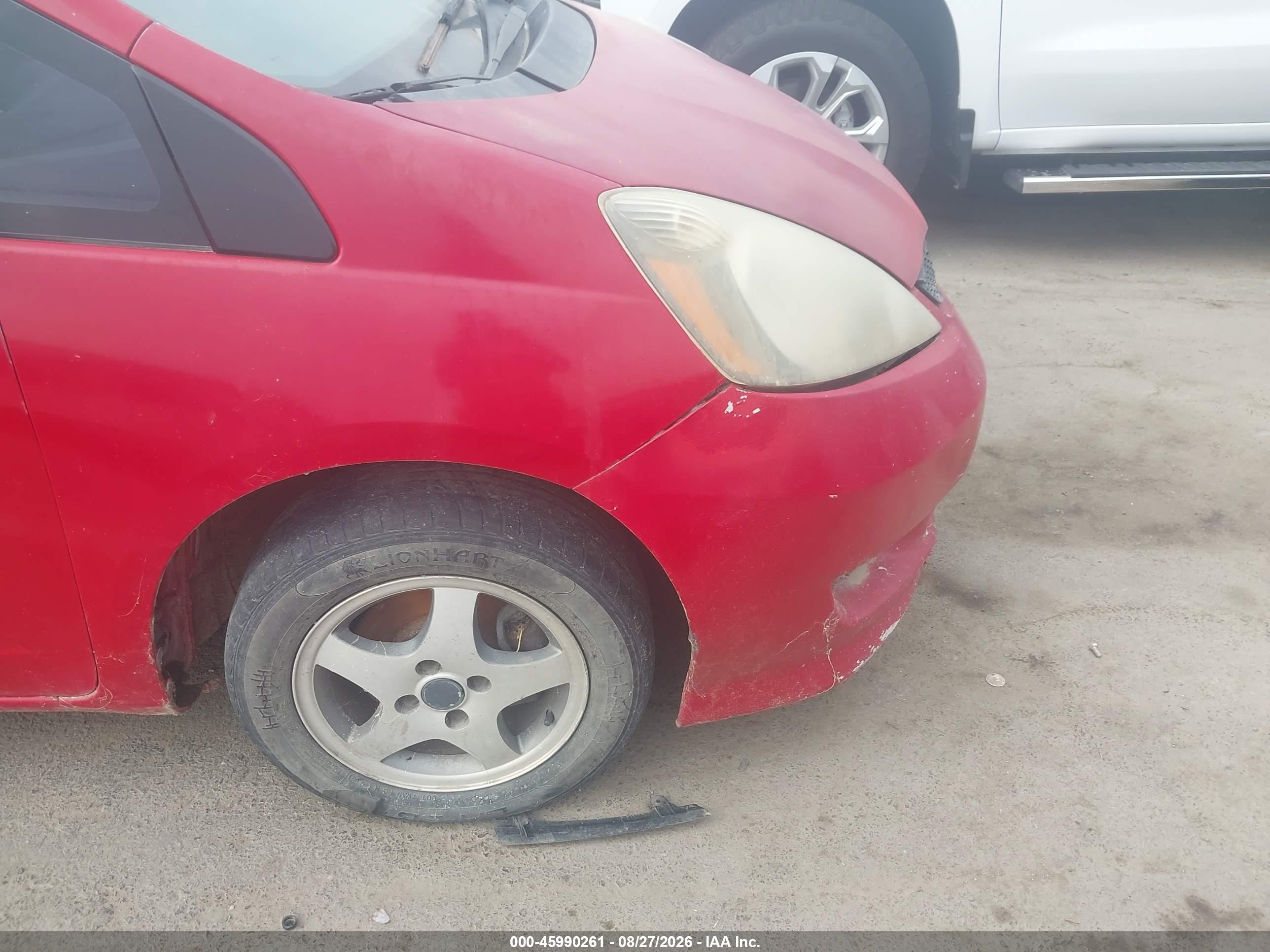 2009 Honda Fit   Red vin: JHMGE87299S009429