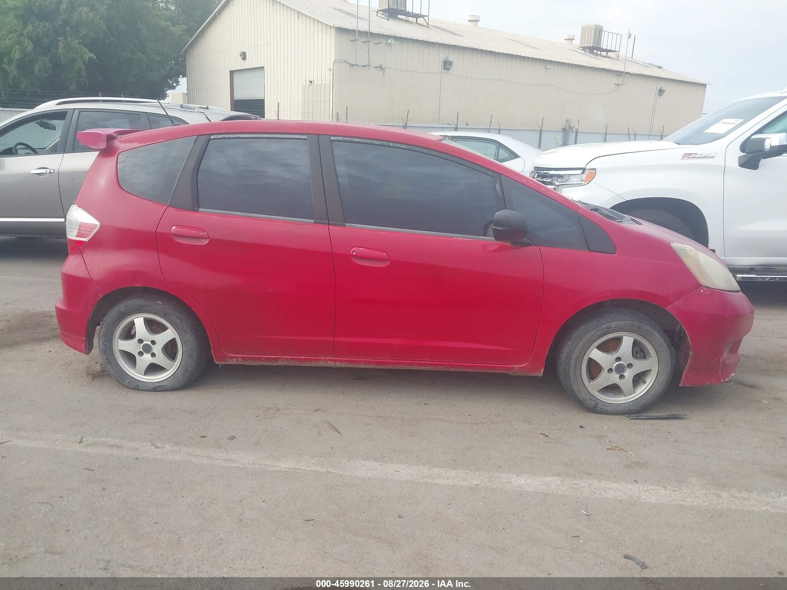 2009 Honda Fit   Red vin: JHMGE87299S009429