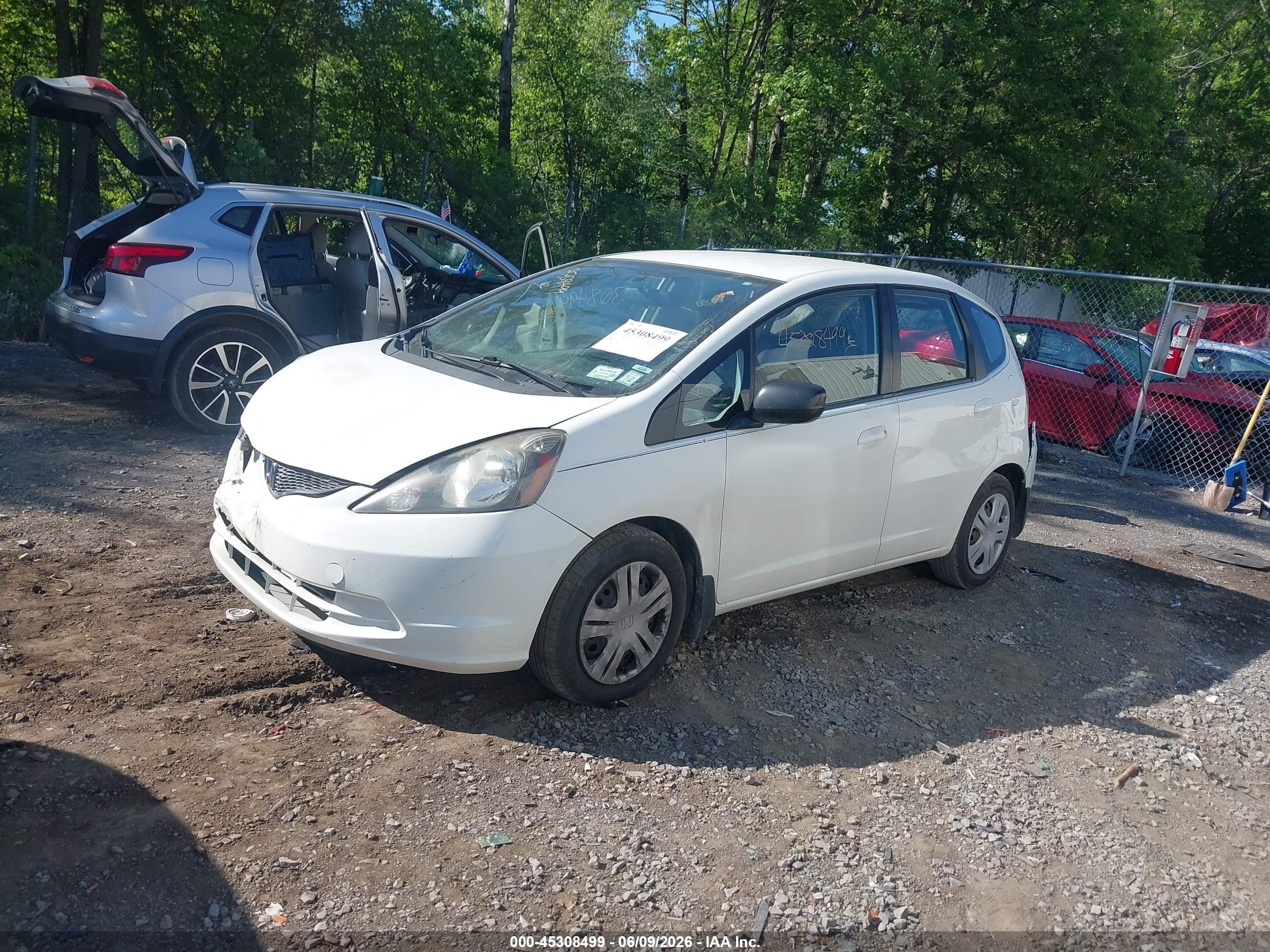 2009 Honda Fit   White vin: JHMGE88259S038022
