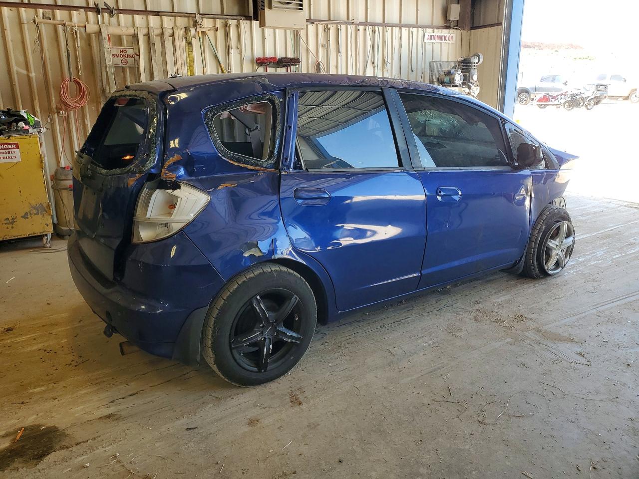 2009 Honda Fit Blue vin: JHMGE88269S058702