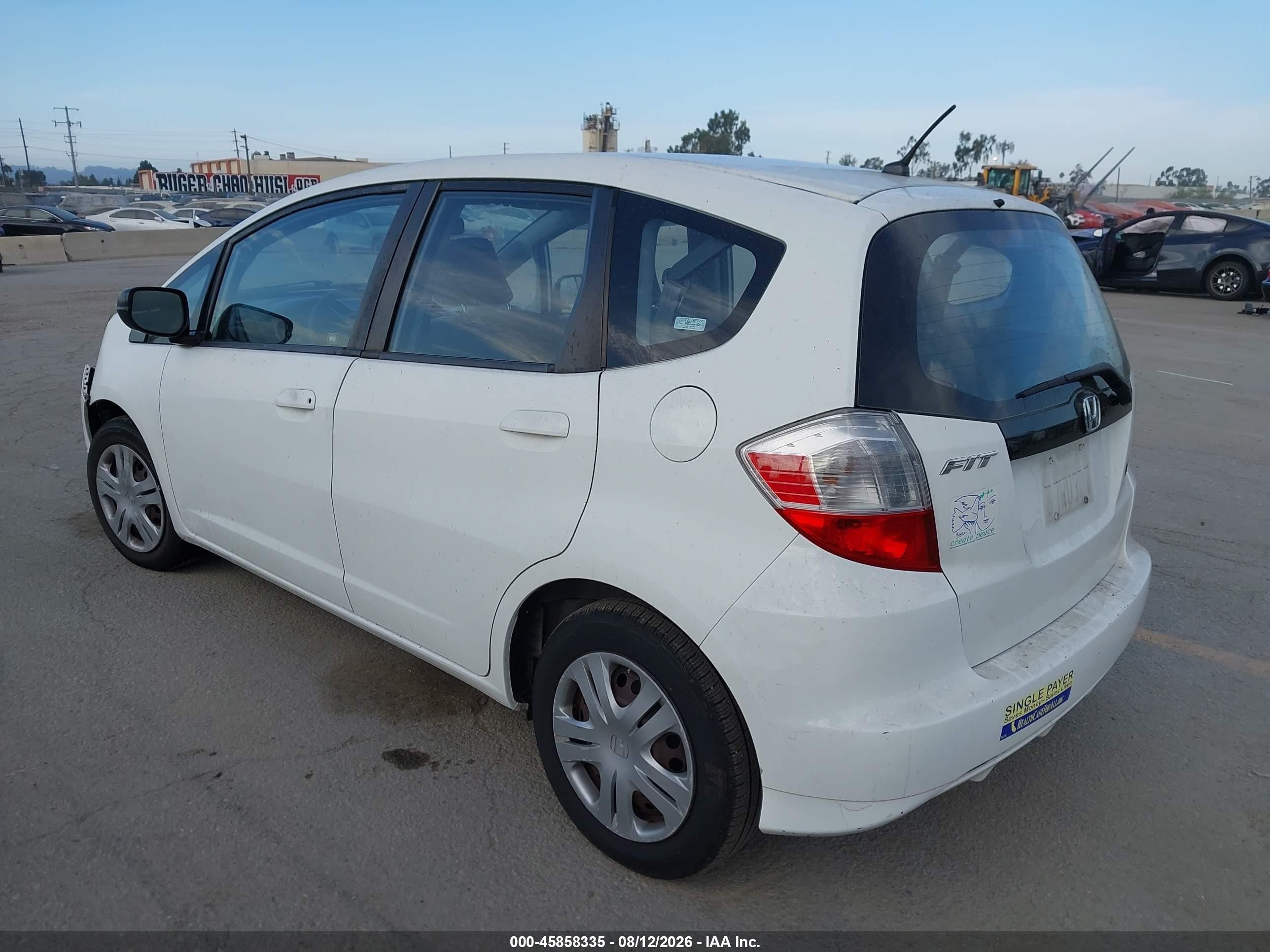 2009 Honda Fit   White vin: JHMGE88299C002232