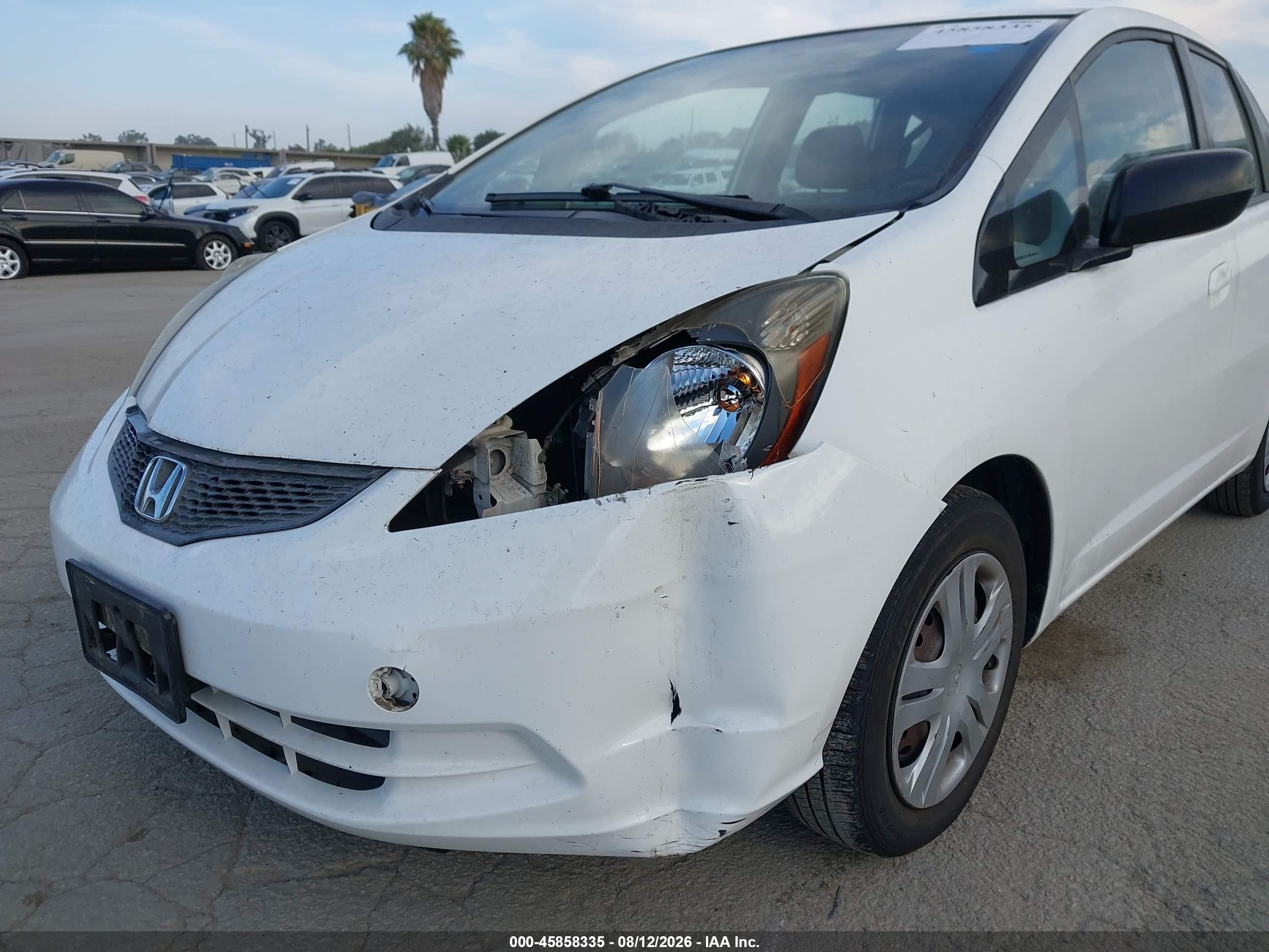 2009 Honda Fit   White vin: JHMGE88299C002232