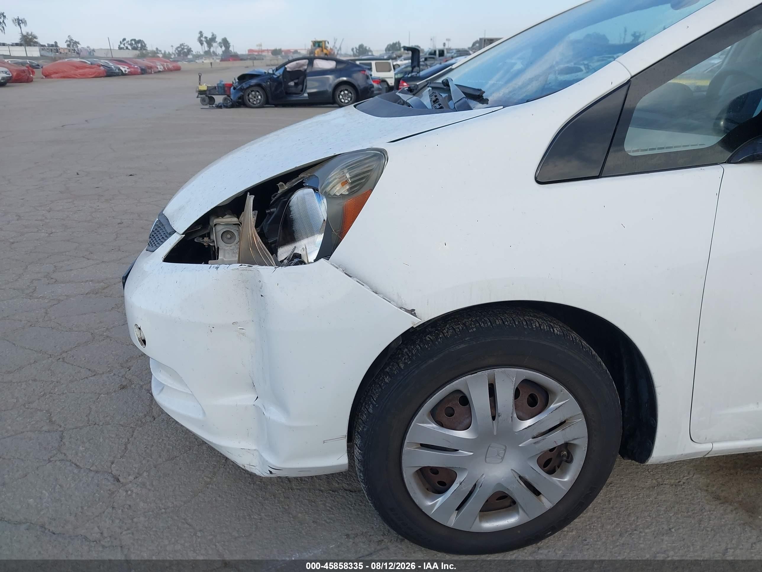 2009 Honda Fit   White vin: JHMGE88299C002232
