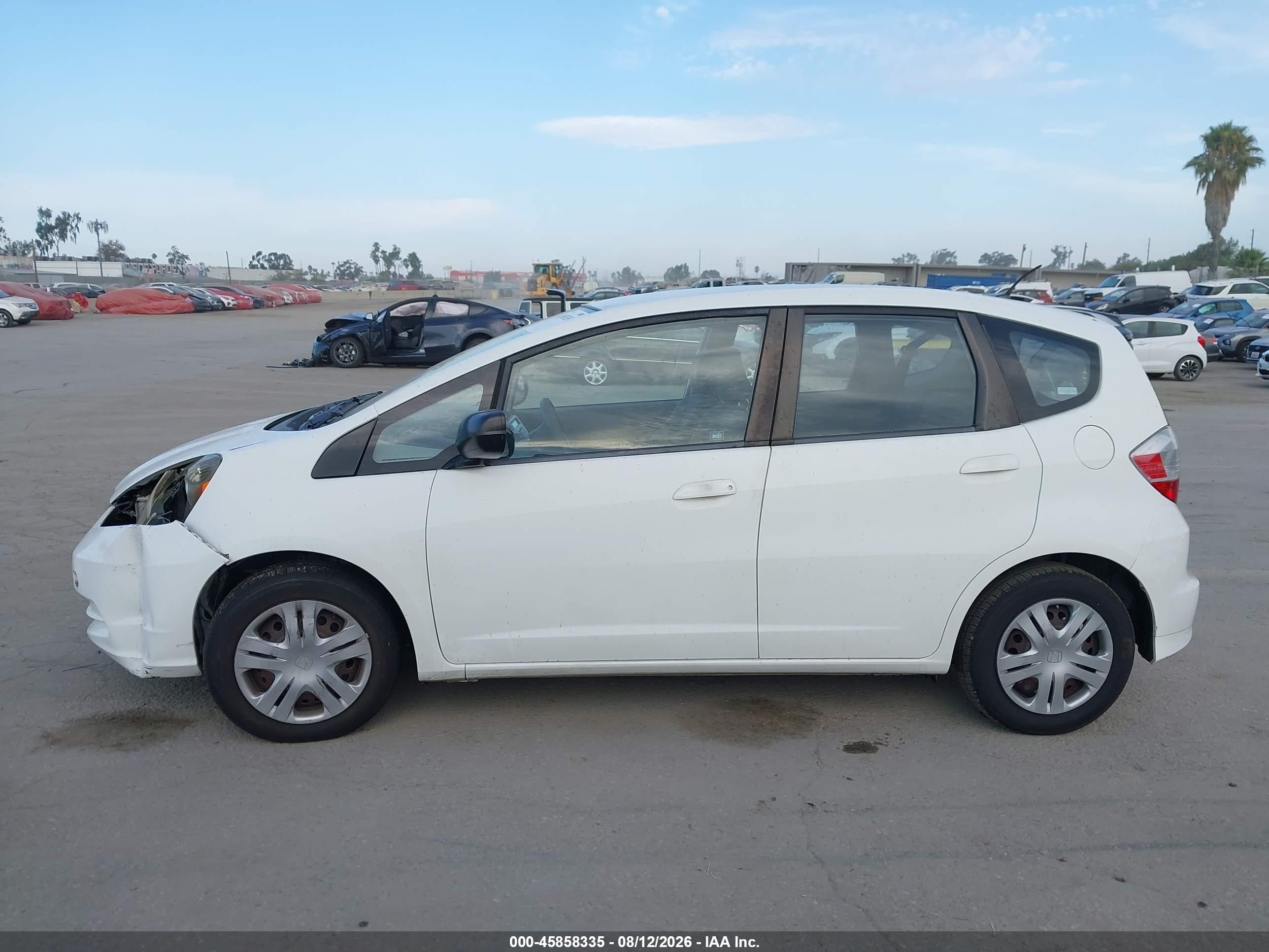 2009 Honda Fit   White vin: JHMGE88299C002232