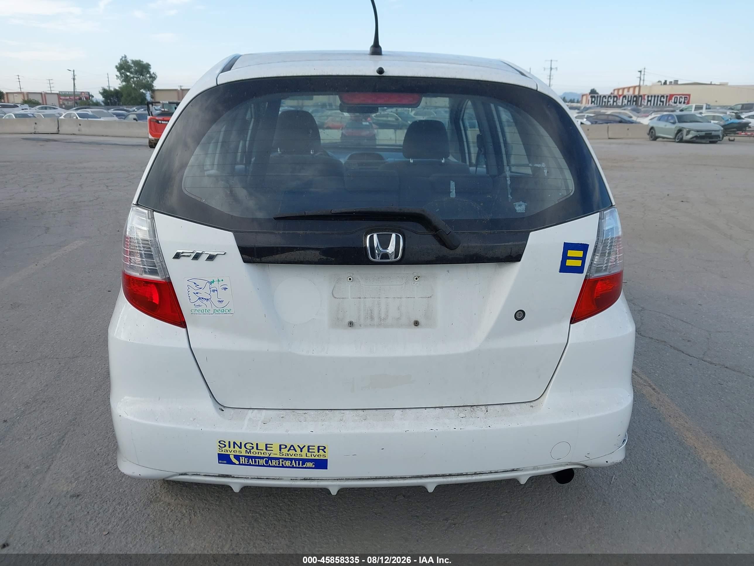 2009 Honda Fit   White vin: JHMGE88299C002232