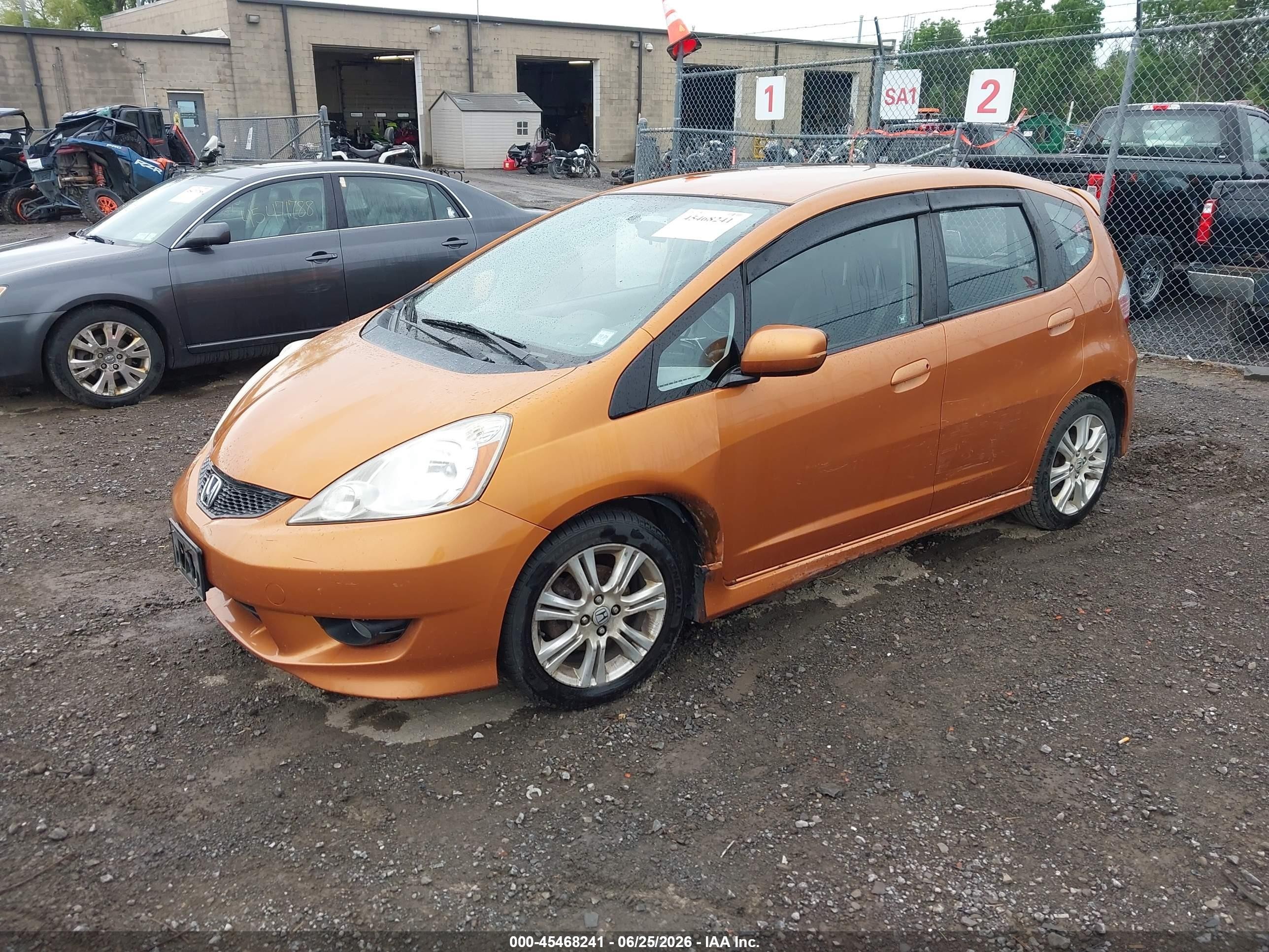 2009 Honda Fit Sport Orange vin: JHMGE88469S074349