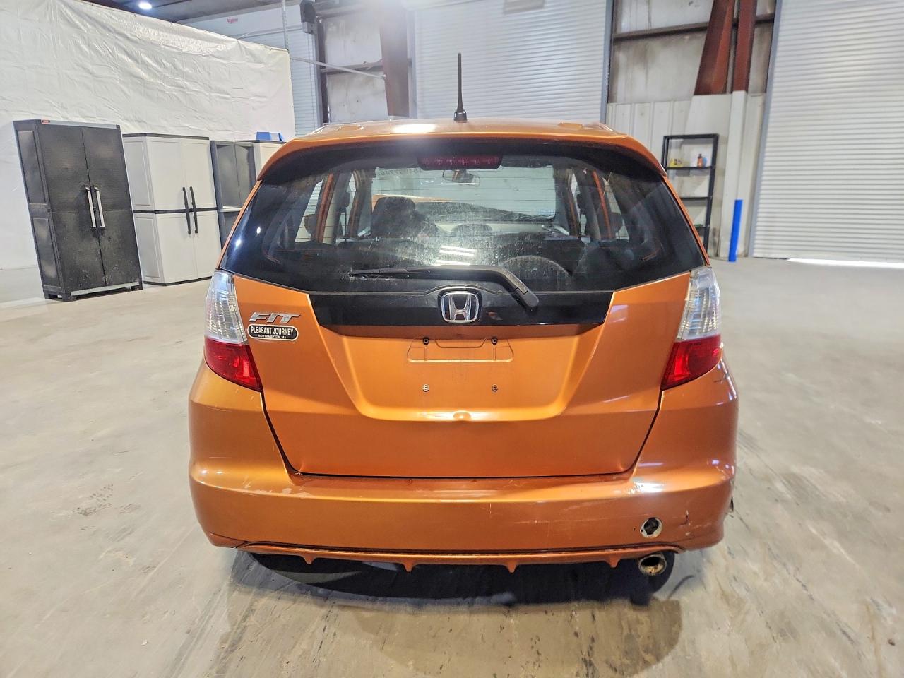 2009 Honda Fit Sport Orange vin: JHMGE88499S048490