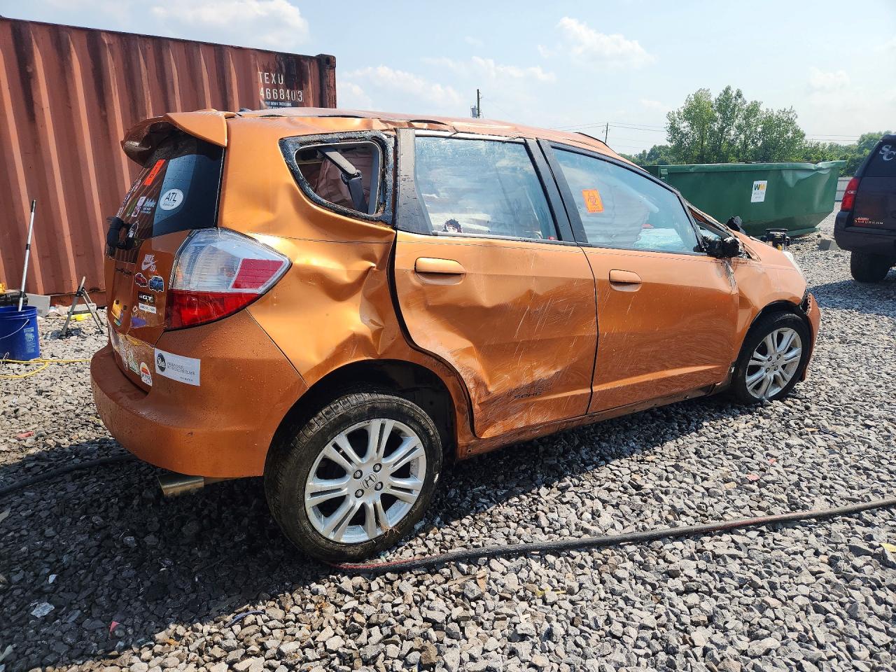 2009 Honda Fit Sport Orange vin: JHMGE884X9S033576