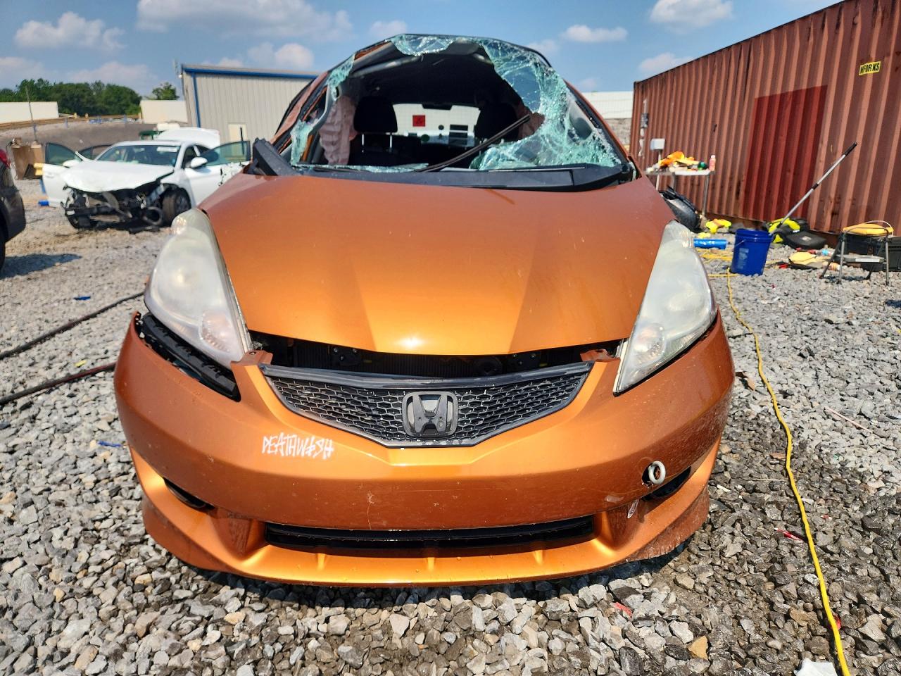 2009 Honda Fit Sport Orange vin: JHMGE884X9S033576