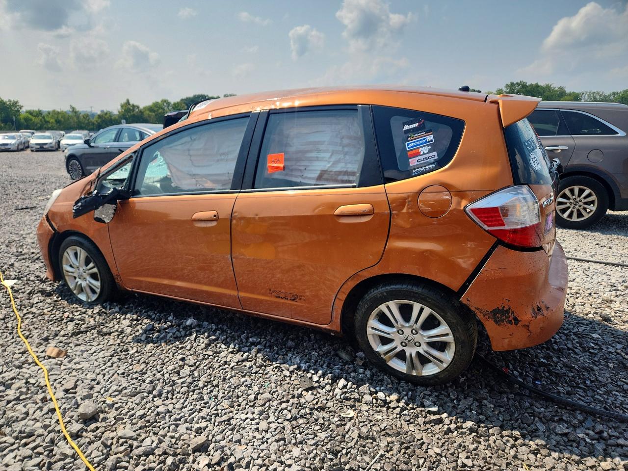 2009 Honda Fit Sport Orange vin: JHMGE884X9S033576
