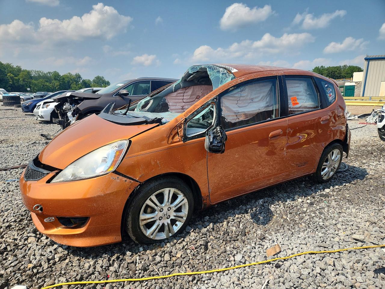 2009 Honda Fit Sport Orange vin: JHMGE884X9S033576