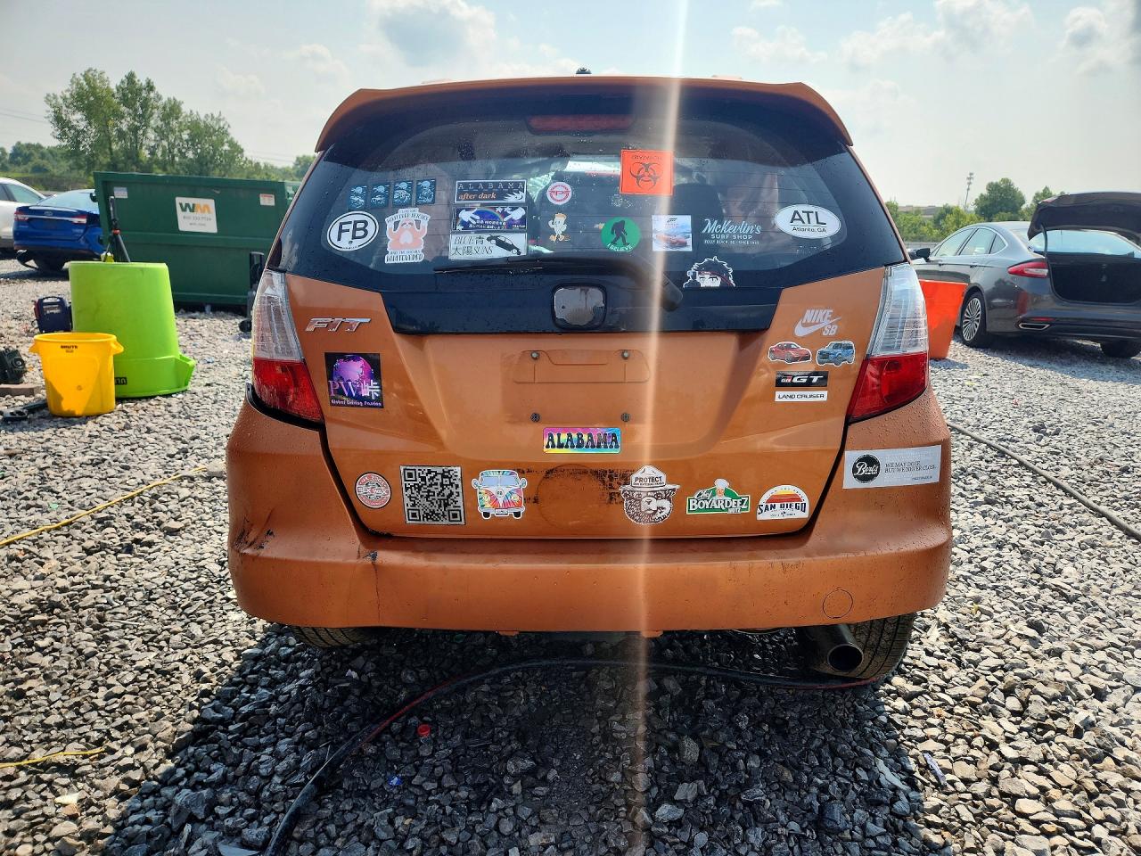 2009 Honda Fit Sport Orange vin: JHMGE884X9S033576