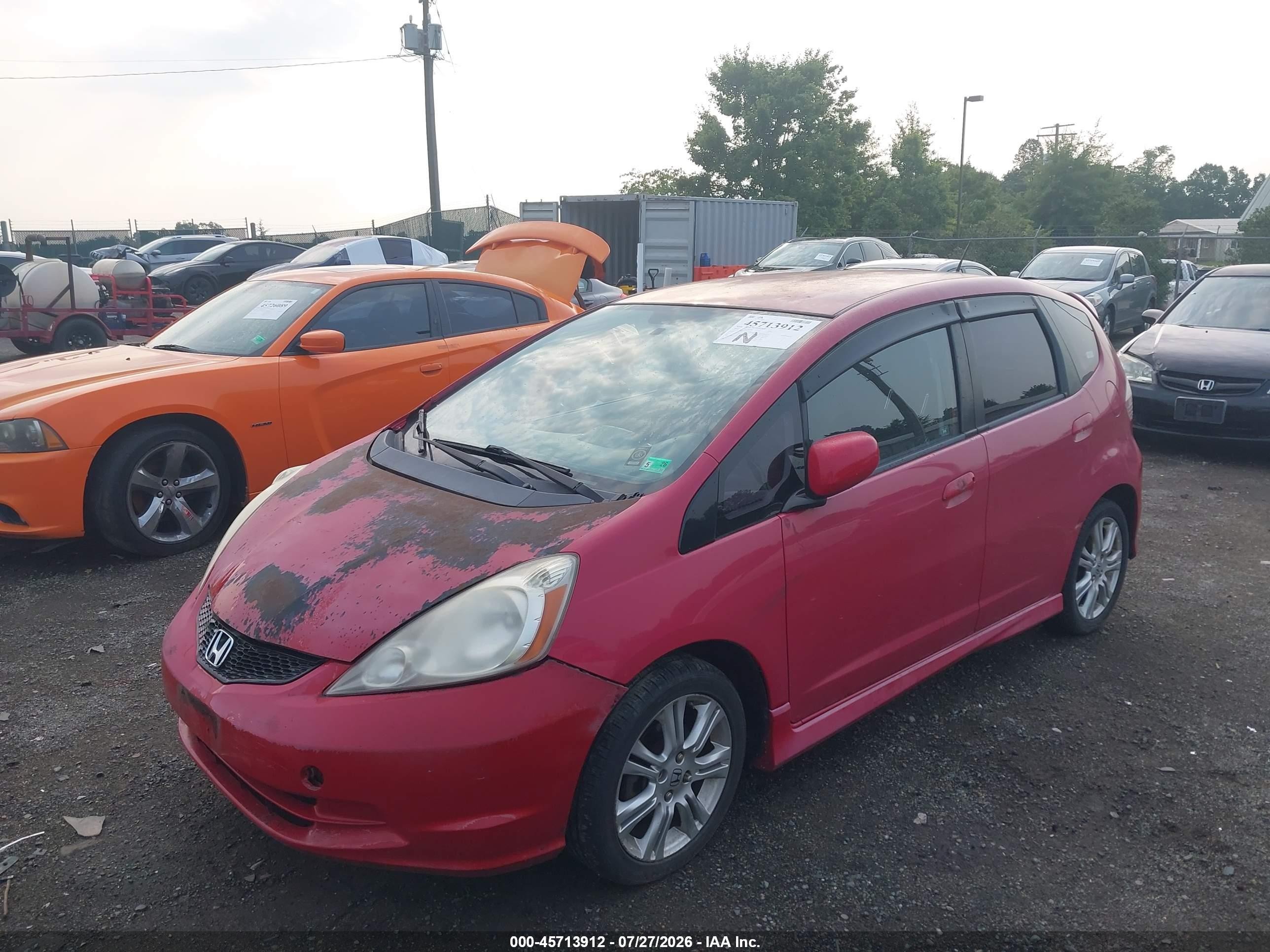 2009 Honda Fit Sport Red vin: JHMGE884X9S036574