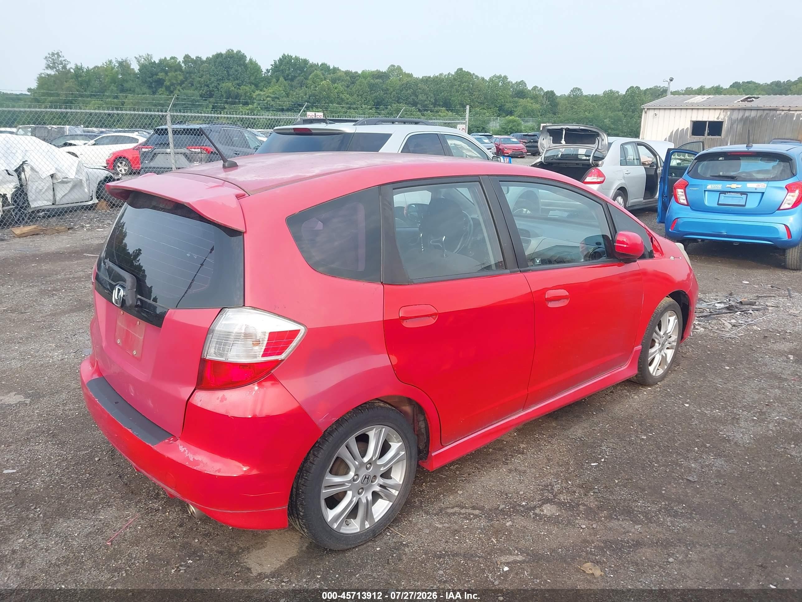 2009 Honda Fit Sport Red vin: JHMGE884X9S036574
