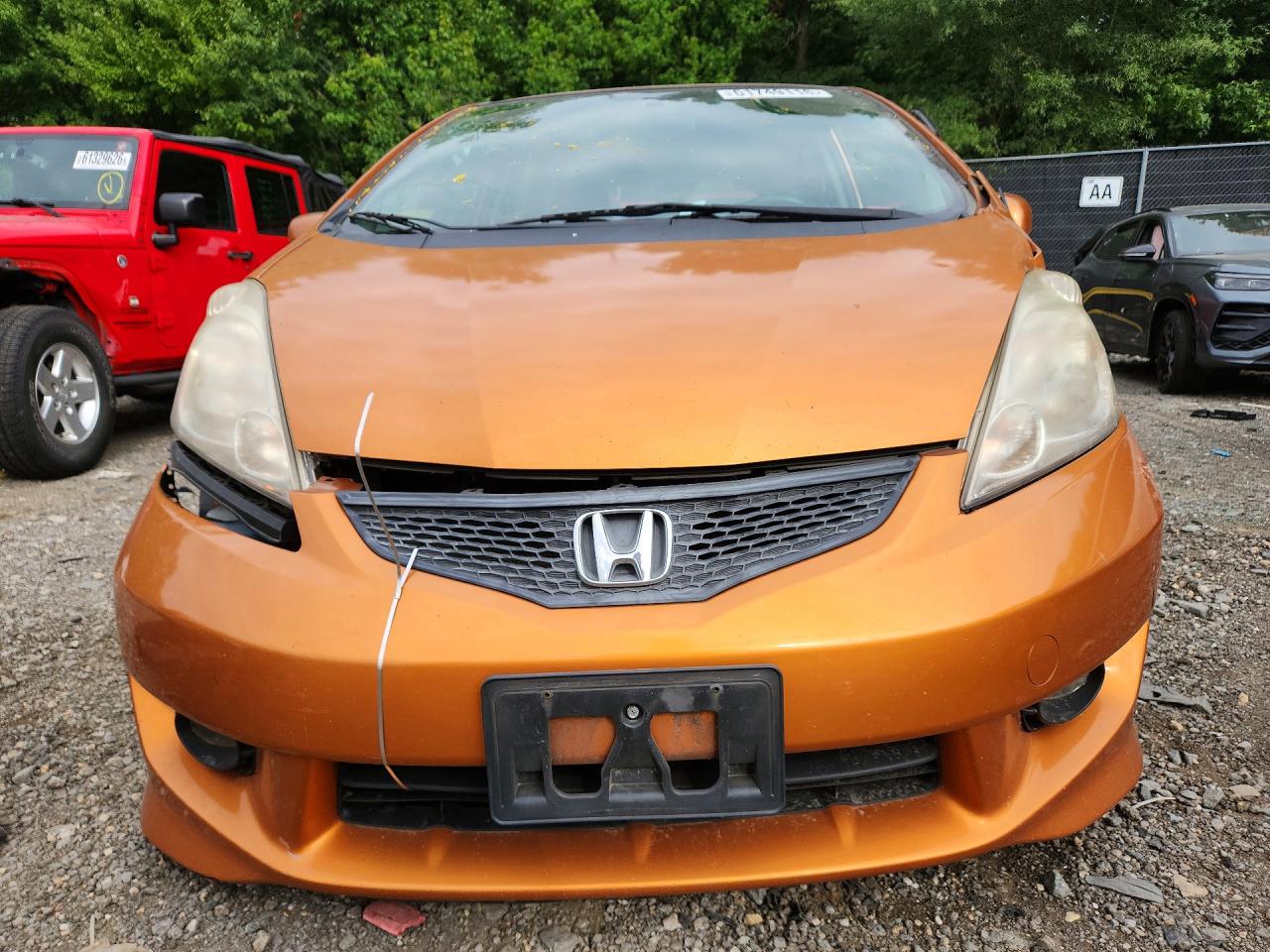 2009 Honda Fit Sport Orange vin: JHMGE884X9S046859