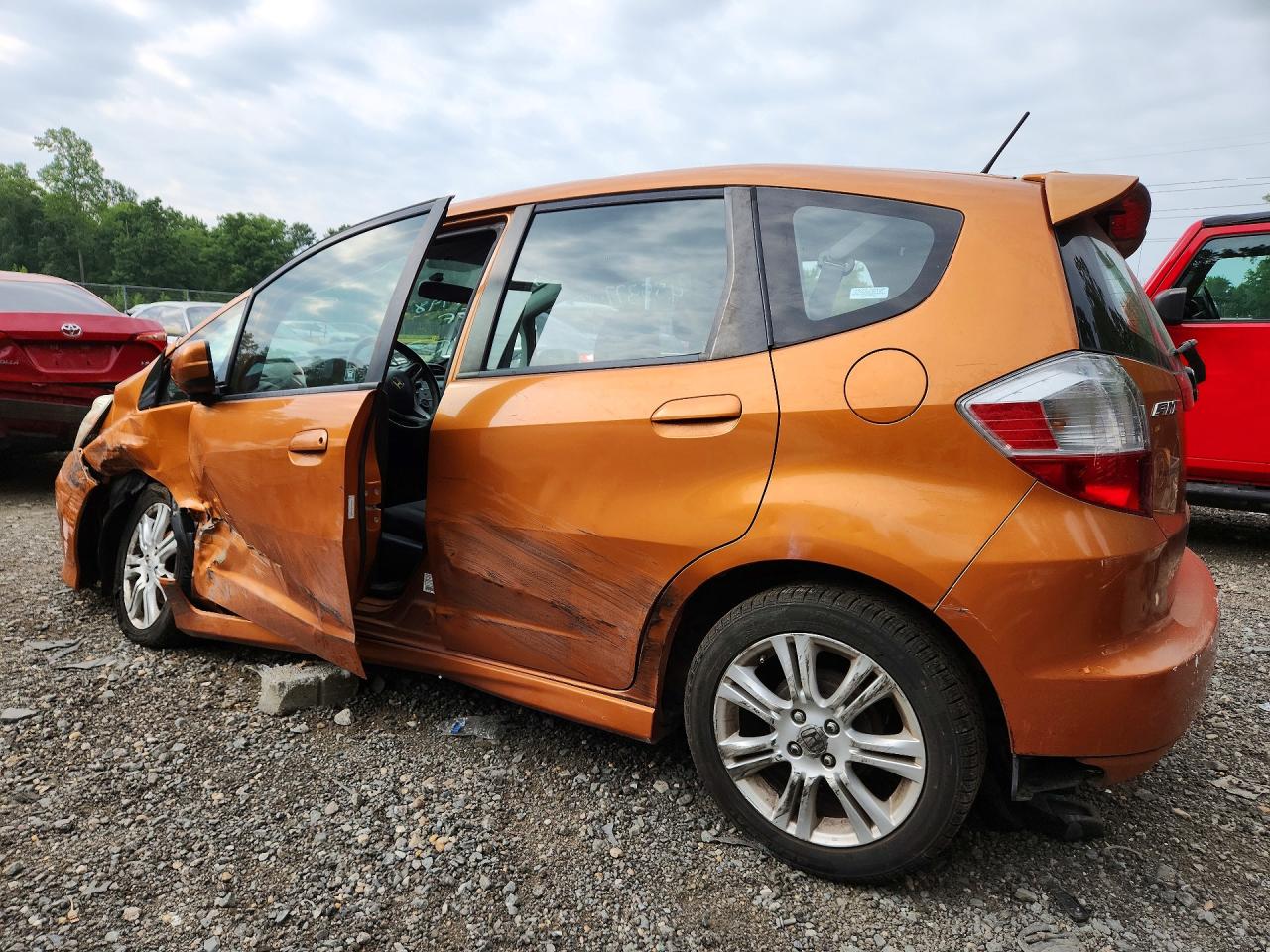 2009 Honda Fit Sport Orange vin: JHMGE884X9S046859