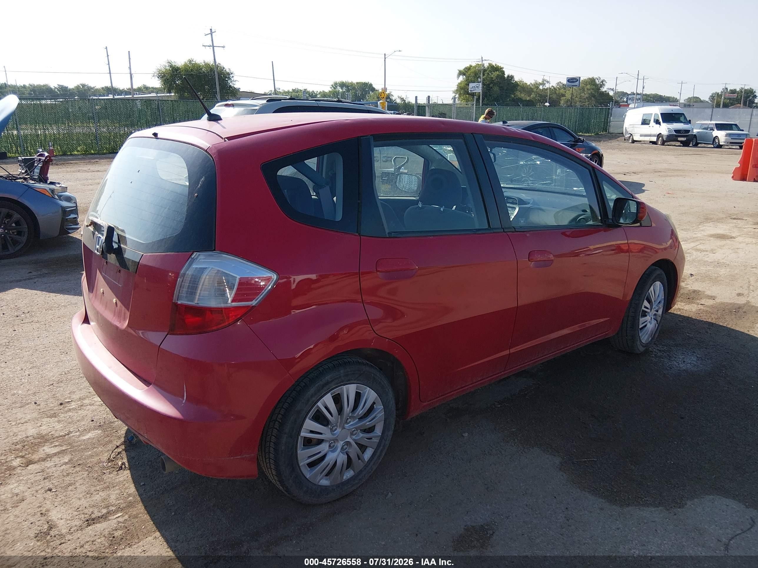 2013 Honda Fit   Red vin: JHMGE8G31DC056174