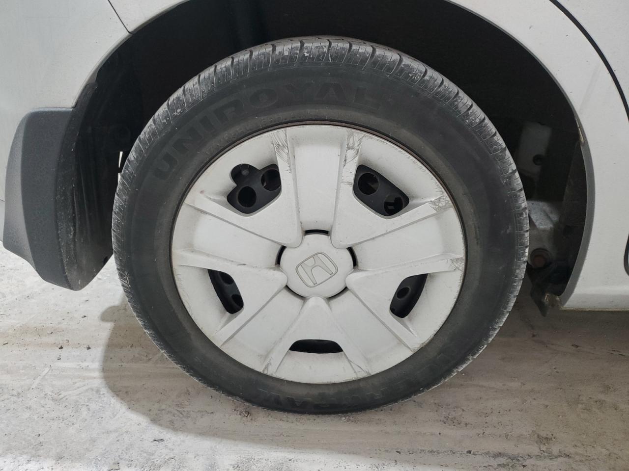 2013 Honda Fit Silver vin: JHMGE8H34DC007906 Damage: Right Rear Wheel Cover, Curb Rash, > 12 Inches