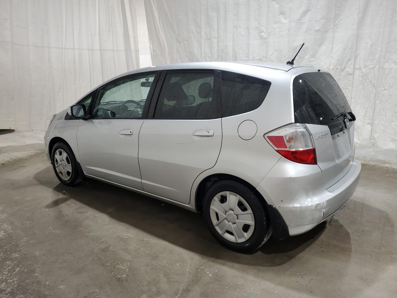 2013 Honda Fit Silver vin: JHMGE8H34DC007906 Damage: Left Rear Door, Multiple Scratches Heavy, 3