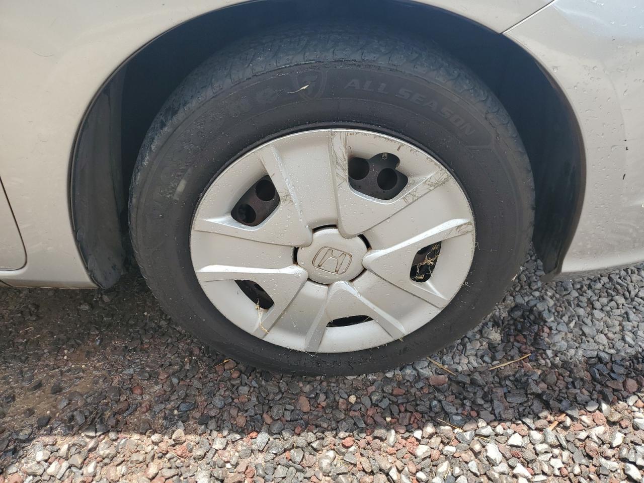 2012 Honda Fit Silver vin: JHMGE8H38CC017000 Damage: Right Front Wheel Cover, Curb Rash, > 12 Inches
