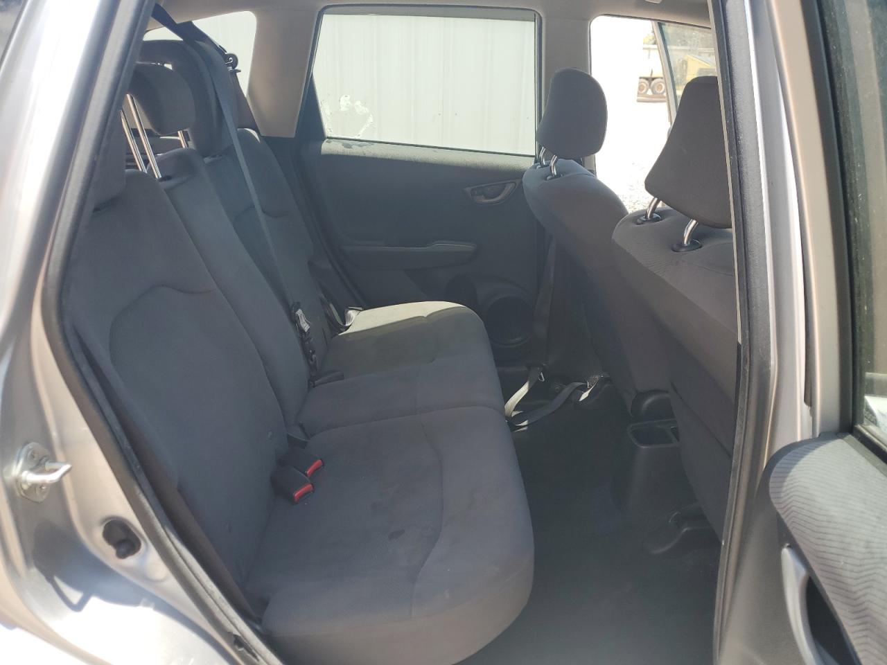 2012 Honda Fit Silver vin: JHMGE8H38CC017000 Damage: Right Rear Seat, Stained, Permanent