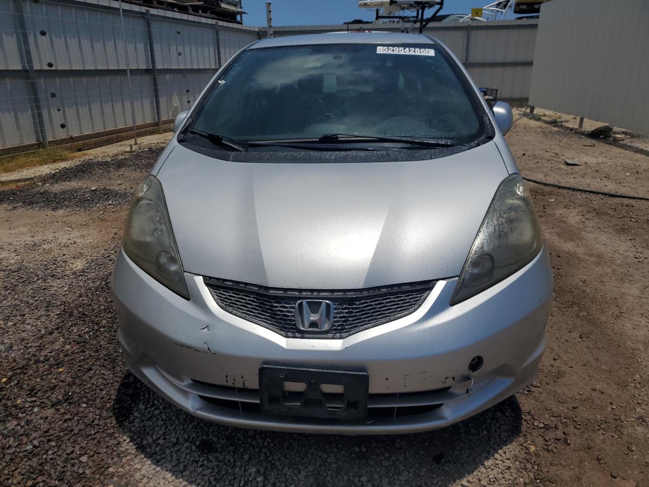 2012 Honda Fit Silver vin: JHMGE8H38CC017000 Damage: Left Head Lamp, Faded, Repair Required