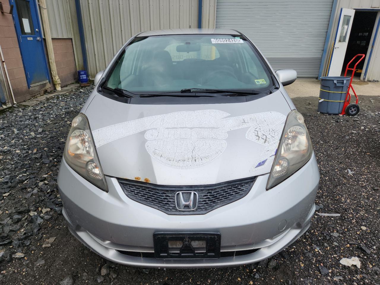 2012 Honda Fit Silver vin: JHMGE8H38CS002129 Damage: Left Head Lamp, Faded, Repair Required