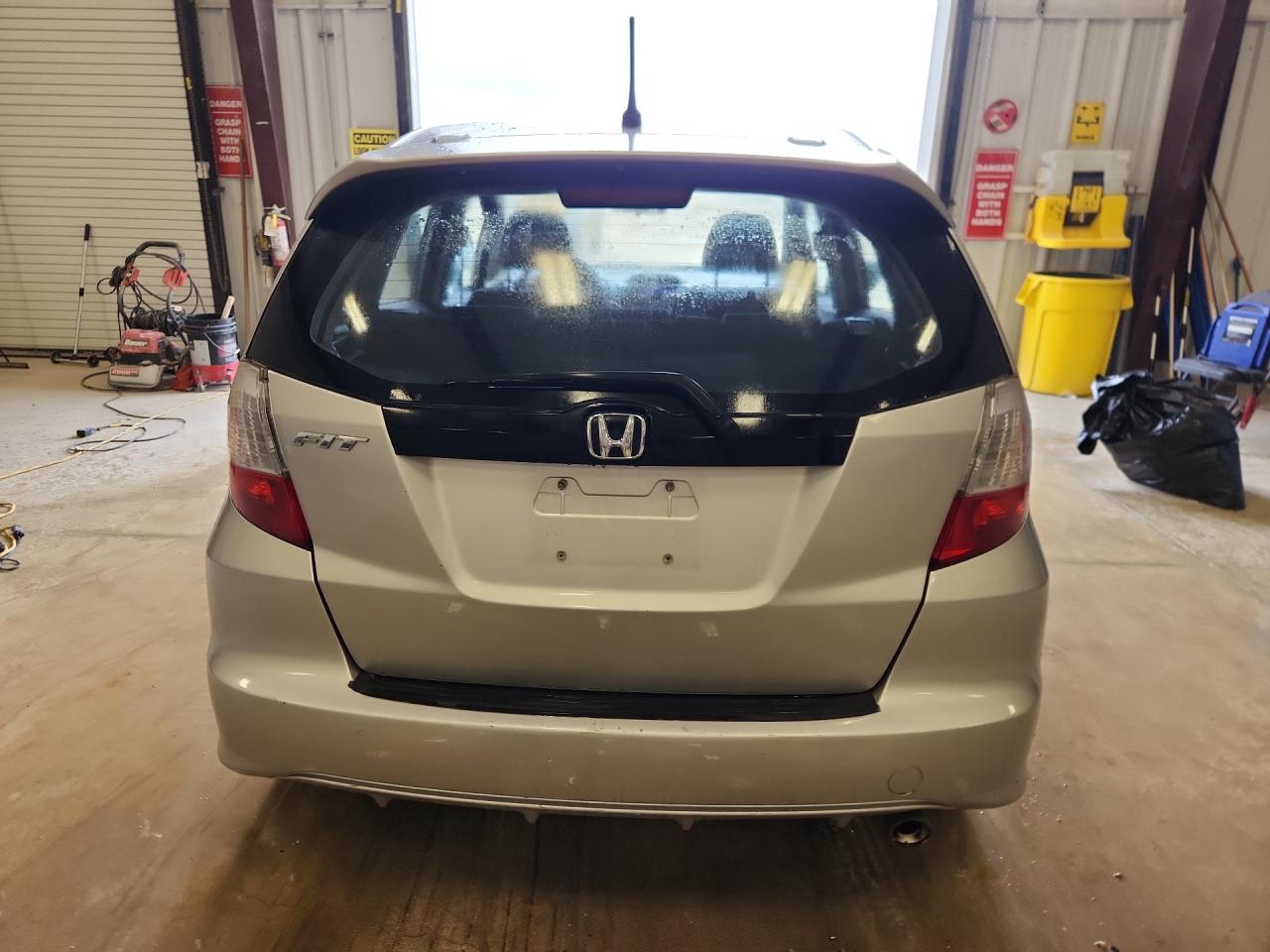 2013 Honda Fit Sport Silver vin: JHMGE8H51DC022302 Damage: Rear Bumper, Heavy Scratch, 1 To 2 Inches