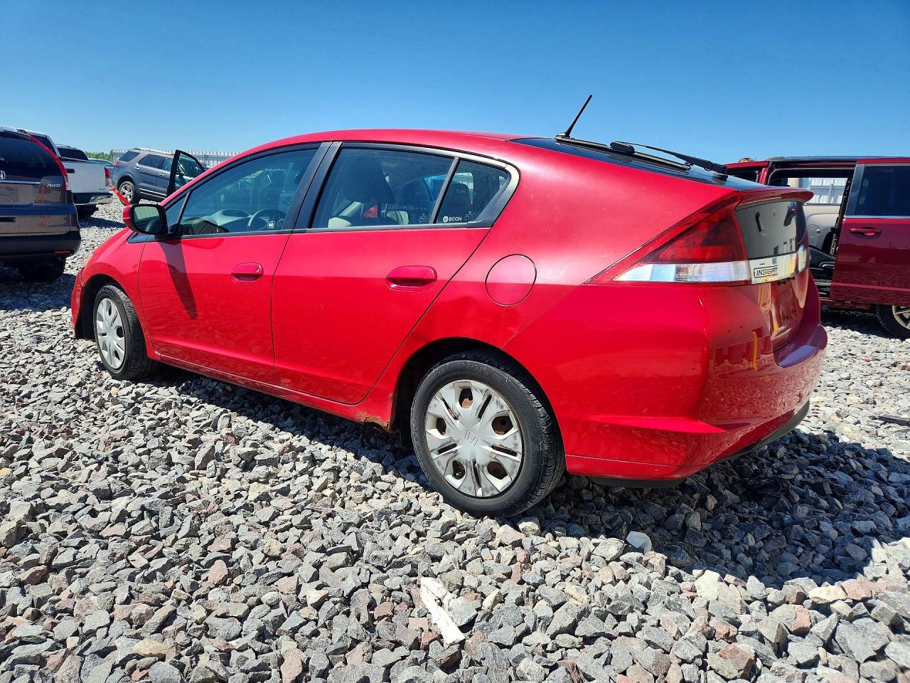 2012 Honda Insight Red vin: JHMZE2H39CS004316