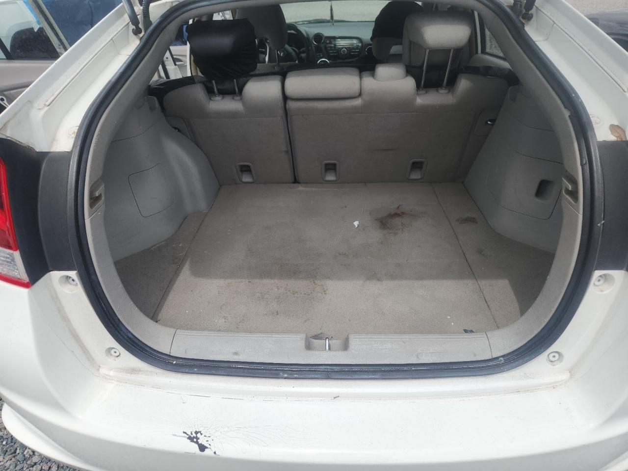 2014 Honda Insight Lx White vin: JHMZE2H56ES000101 Damage: Trunk/Cargo Mat, Stained, Permanent