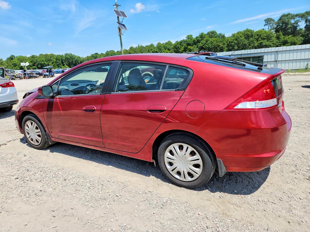 2010 Honda Insight Lx Red vin: JHMZE2H5XAS012293