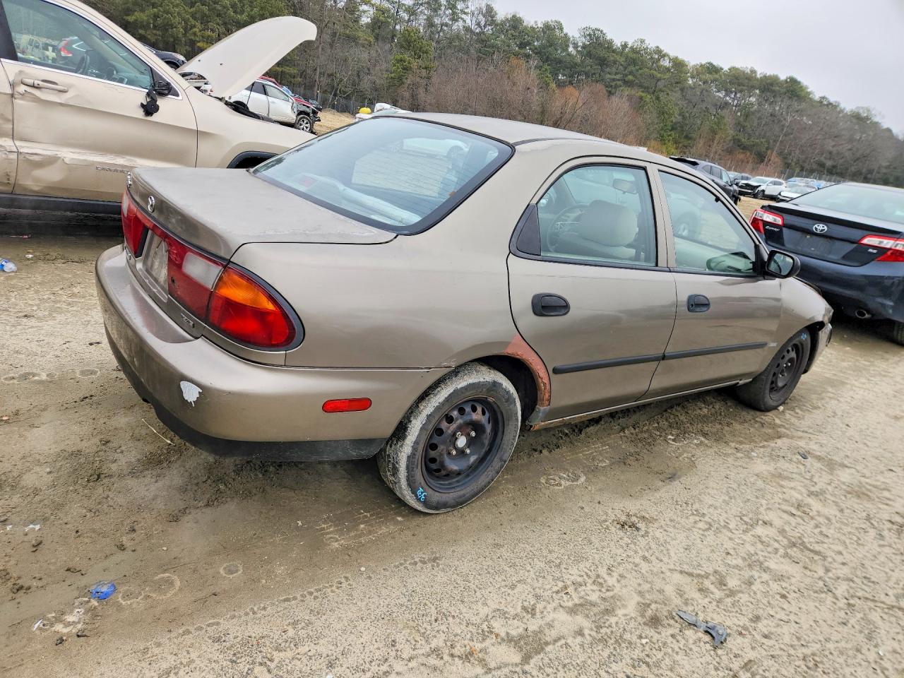 1998 Mazda Protege Dx Tan vin: JM1BC1418W0179387