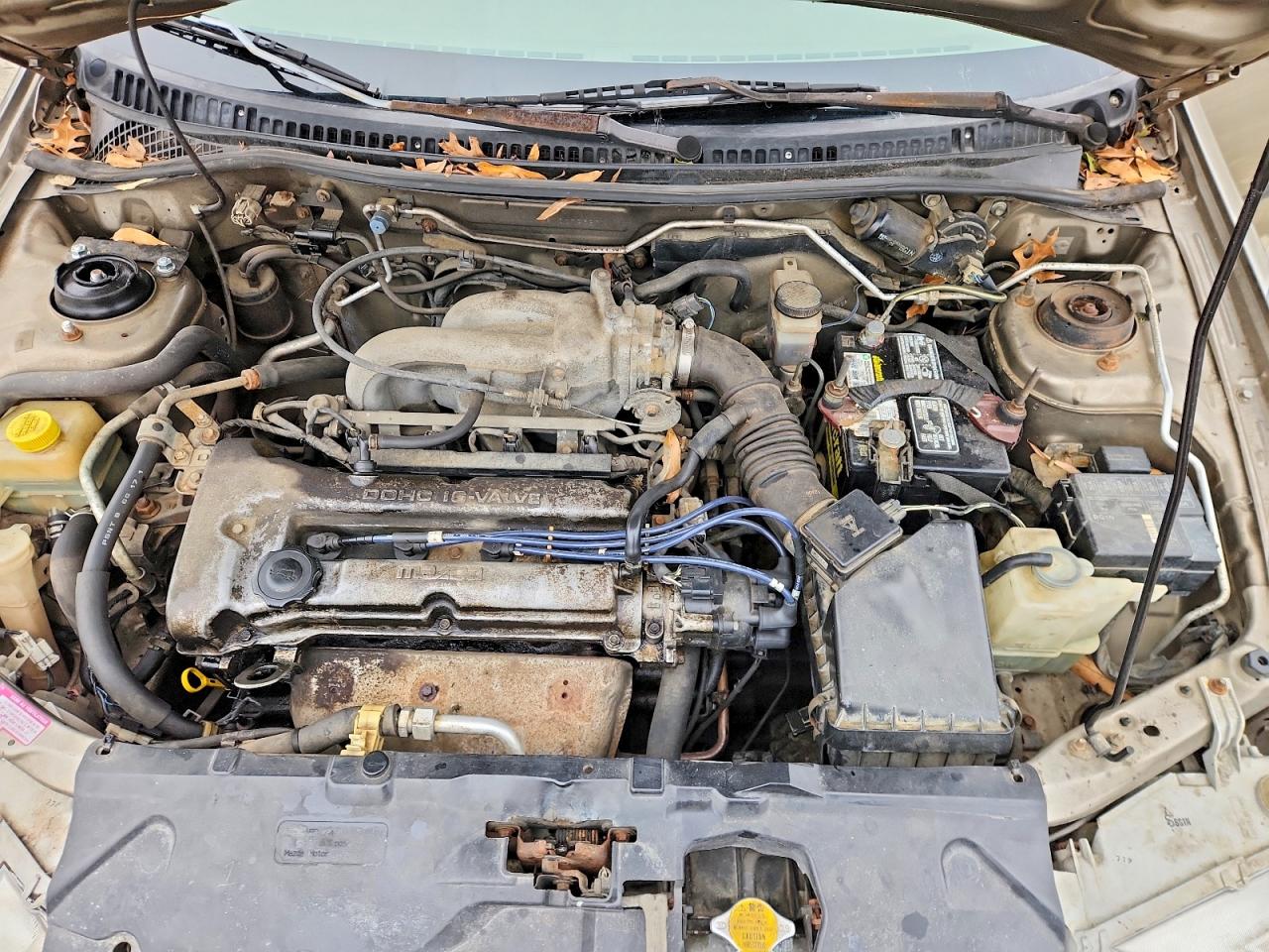 1998 Mazda Protege Dx Tan vin: JM1BC1418W0179387