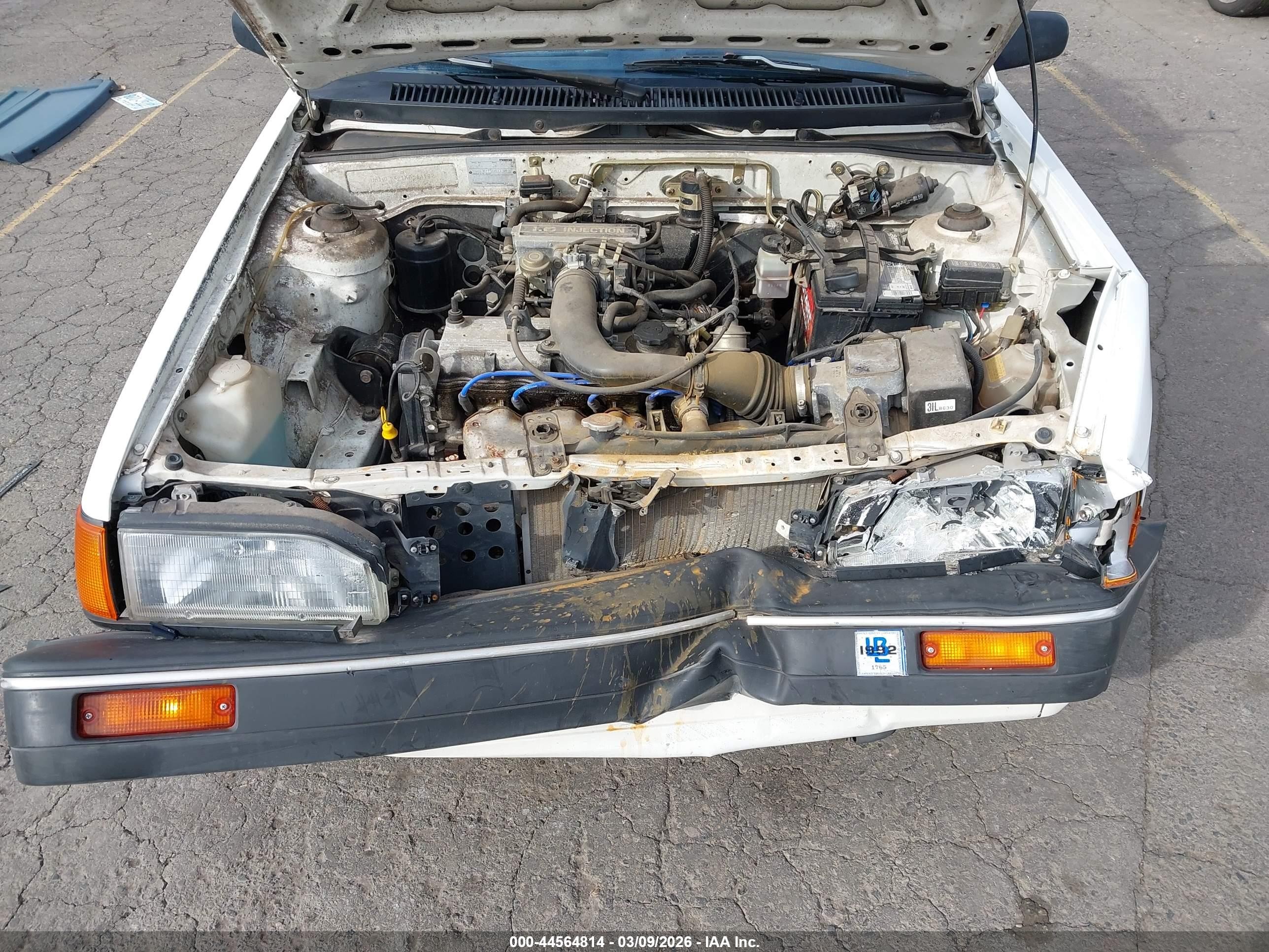 1989 Mazda 323   White vin: JM1BF2321K0343192