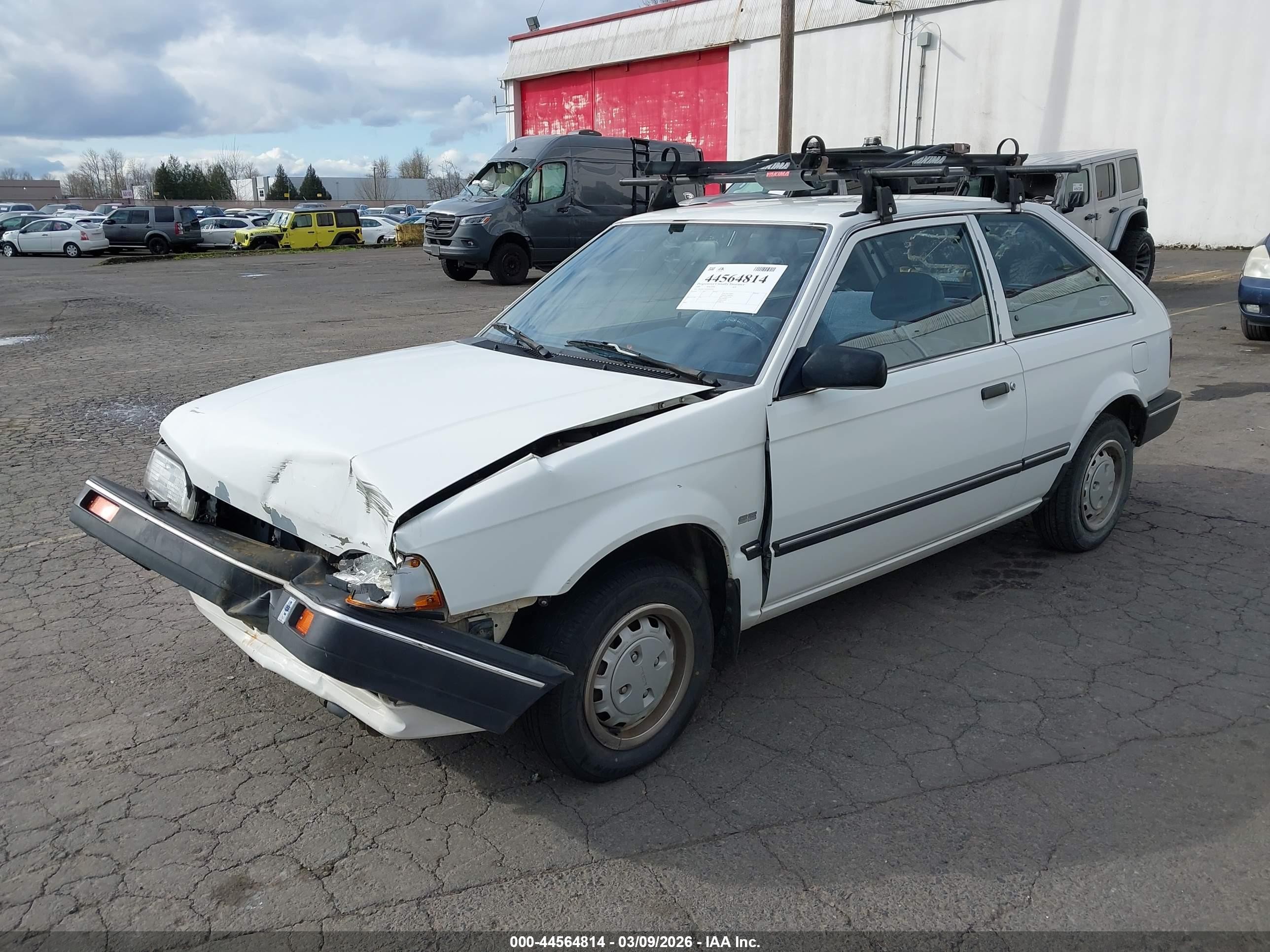 1989 Mazda 323   White vin: JM1BF2321K0343192