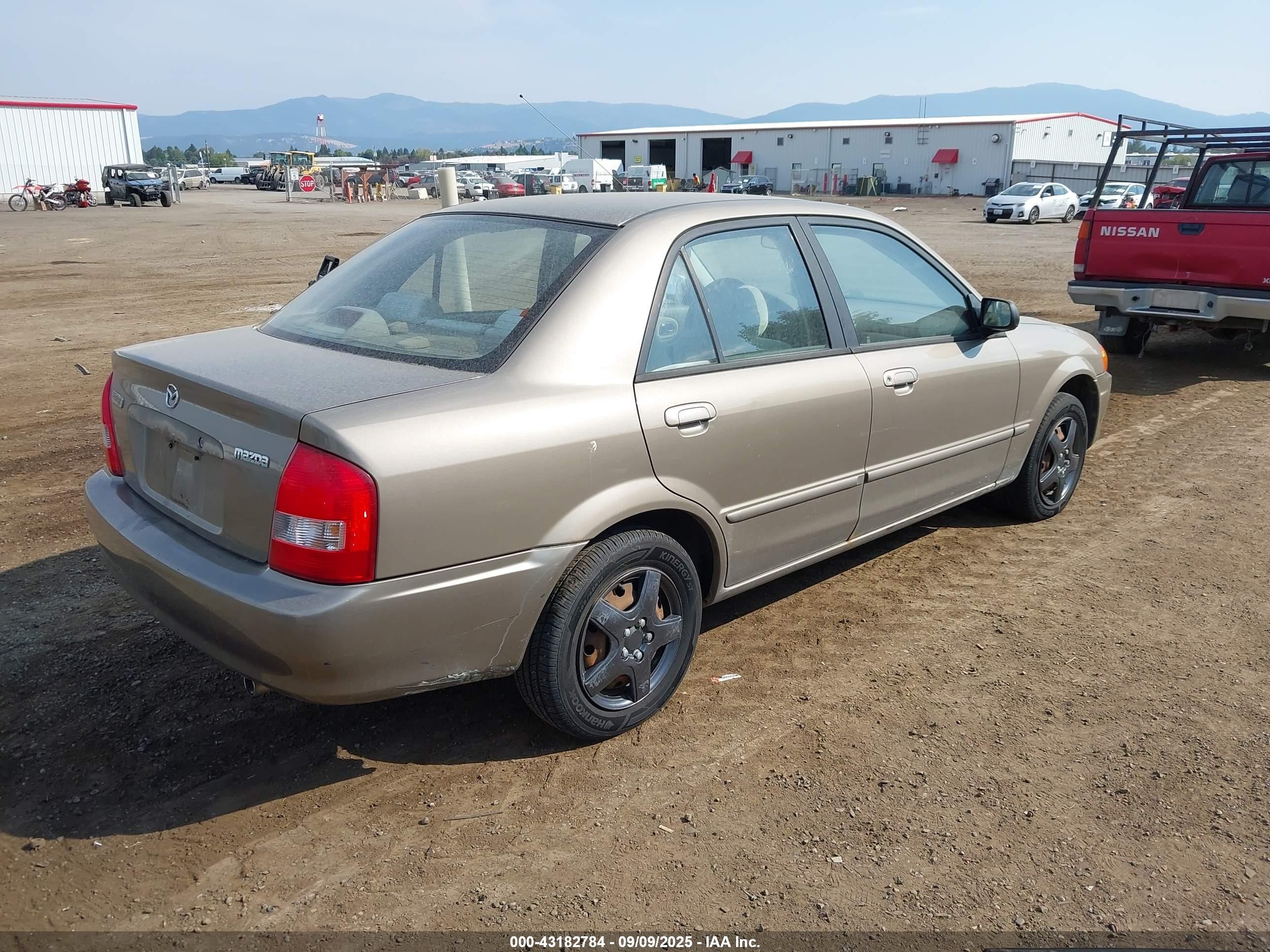 2000 Mazda Protege Dx/lx Champagne vin: JM1BJ2220Y0229709