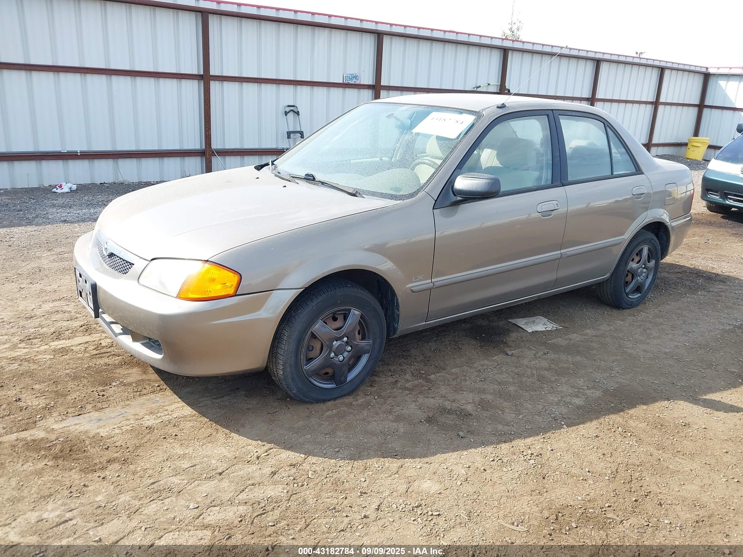 2000 Mazda Protege Dx/lx Champagne vin: JM1BJ2220Y0229709