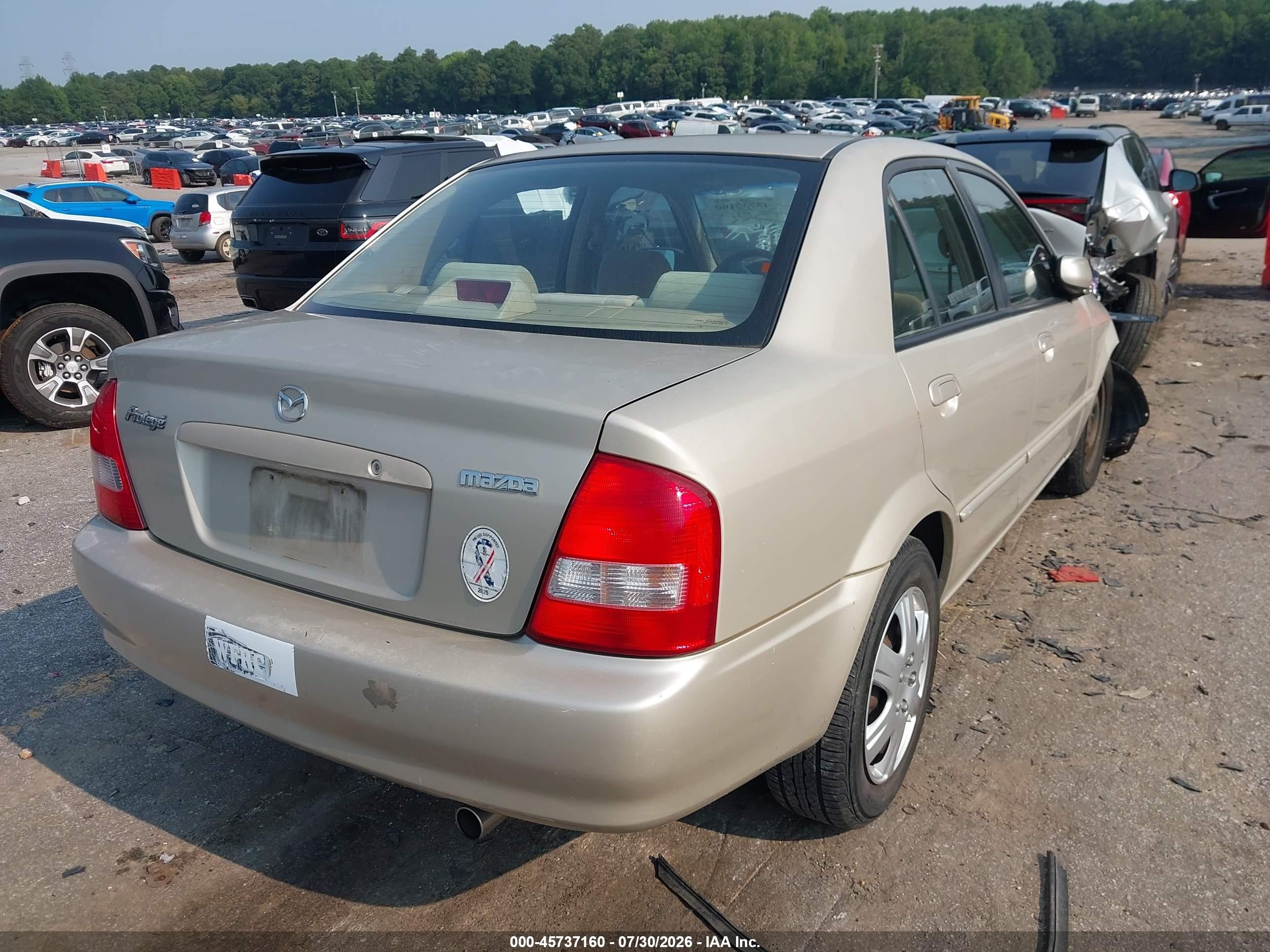 2002 Mazda Protege Dx/es/lx Желто-коричневый vin: JM1BJ225520515735